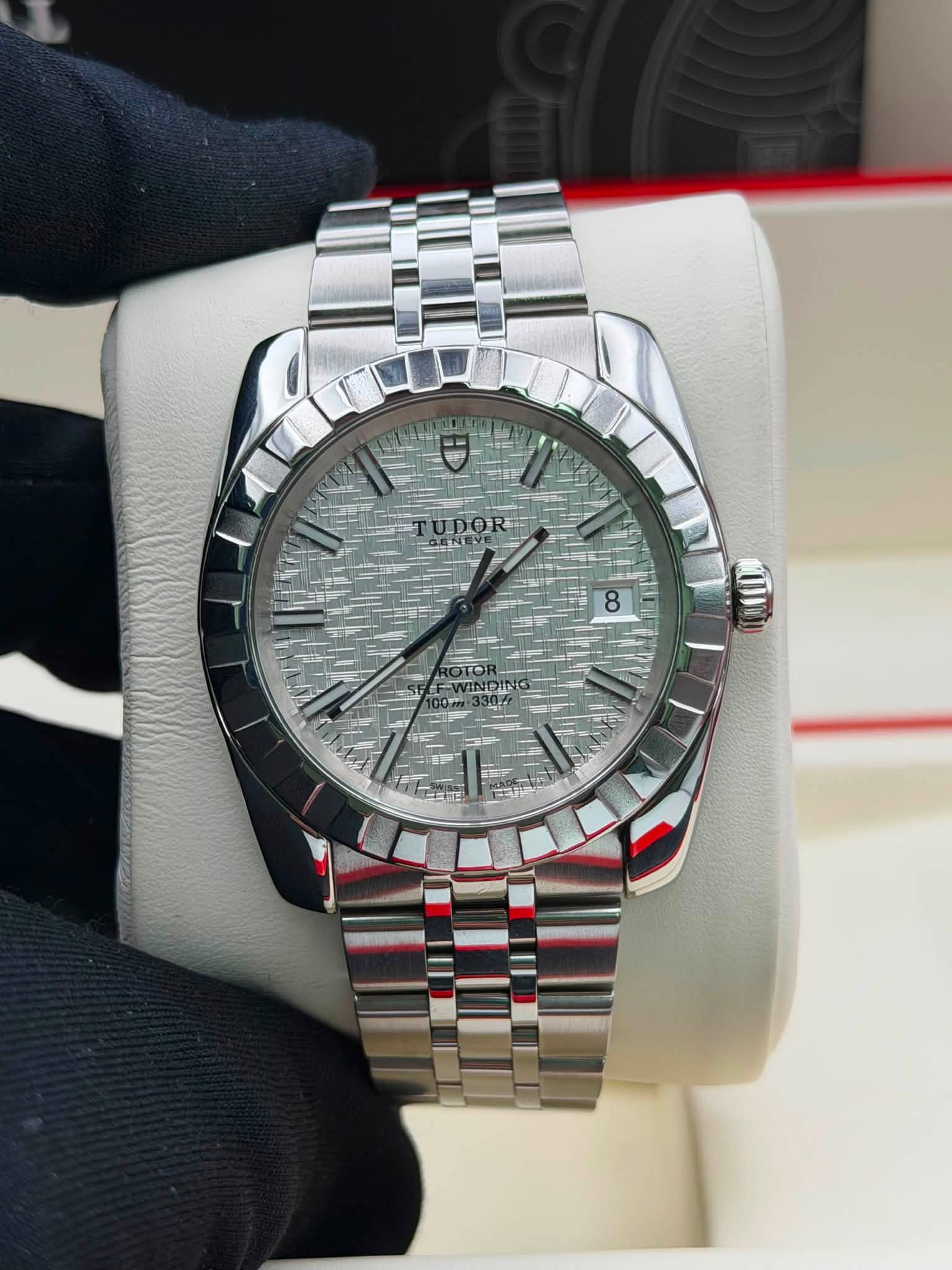 May be an image of wrist watch and text