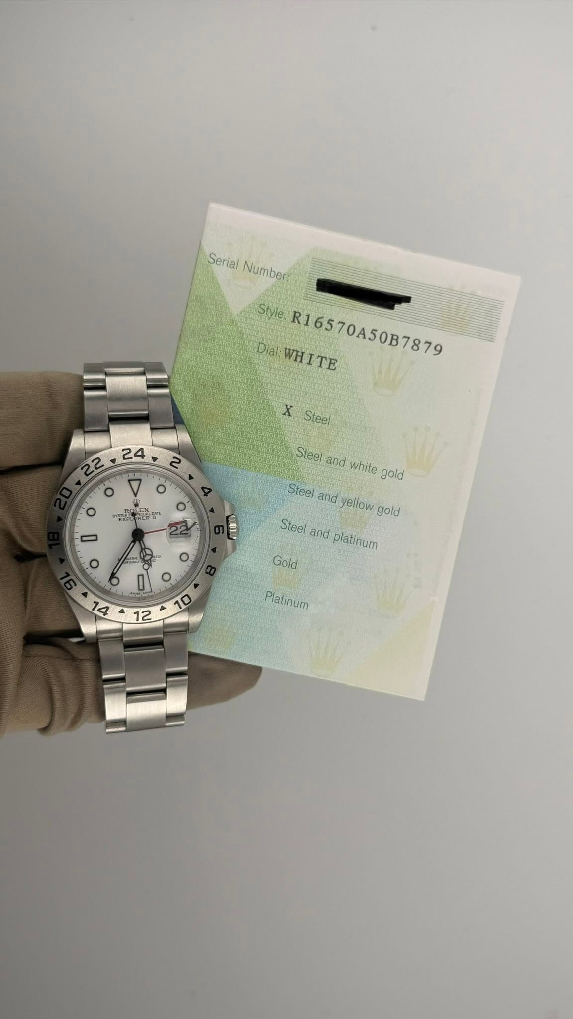 May be an image of ticket stub, wrist watch, money and text that says 'SerialNumber Serial Number: Style: R16570A50B7879 ITE Dial: WH WHITE X Steel 22.24 24 O Steel and white…