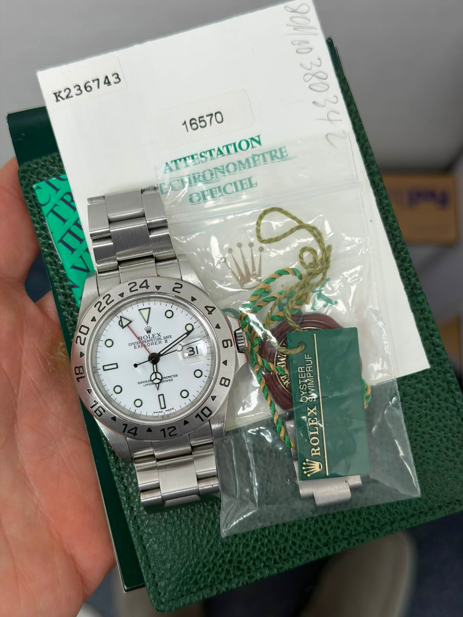 May be an image of wrist watch and text that says 'K236743 K236743 106 gOM 16570 ATTESTATION HRONOMETRE OPEICIEL ROLE OLE 愛 일판맛 好 PLORER o U တ 31 4 มป Ο 8 Ο 0 ب ص እማ ROLEXAU…