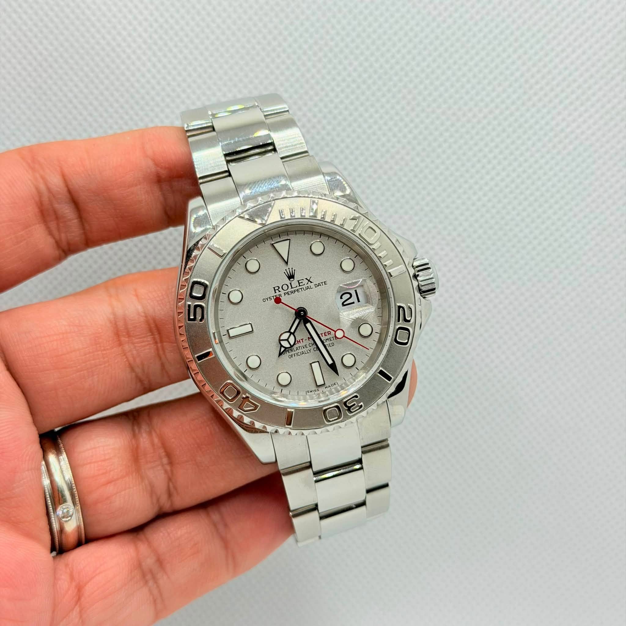 May be an image of wrist watch and text