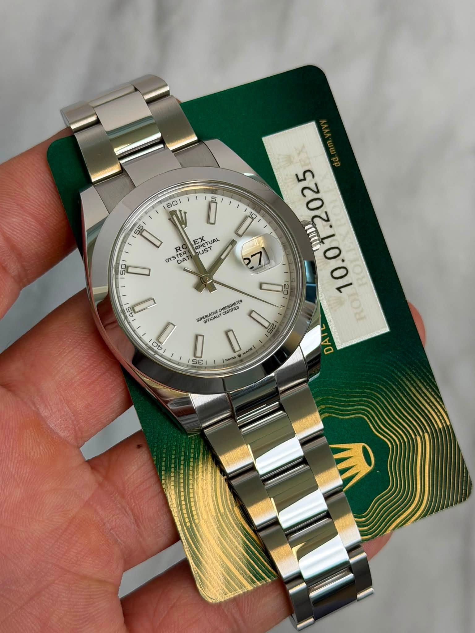 May be an image of wrist watch and text that says '60 5 O 10 10 55 D R DAT TERE DATI EX UST ኢ CEATUAL UAL I PETUAL TUAL OYSTER YSTER UST OYS CONUO o 10.0 ROI DAT D O0 A OL OA…