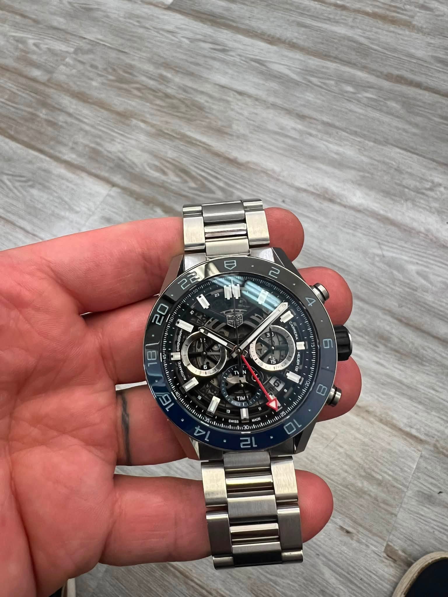May be an image of wrist watch and text