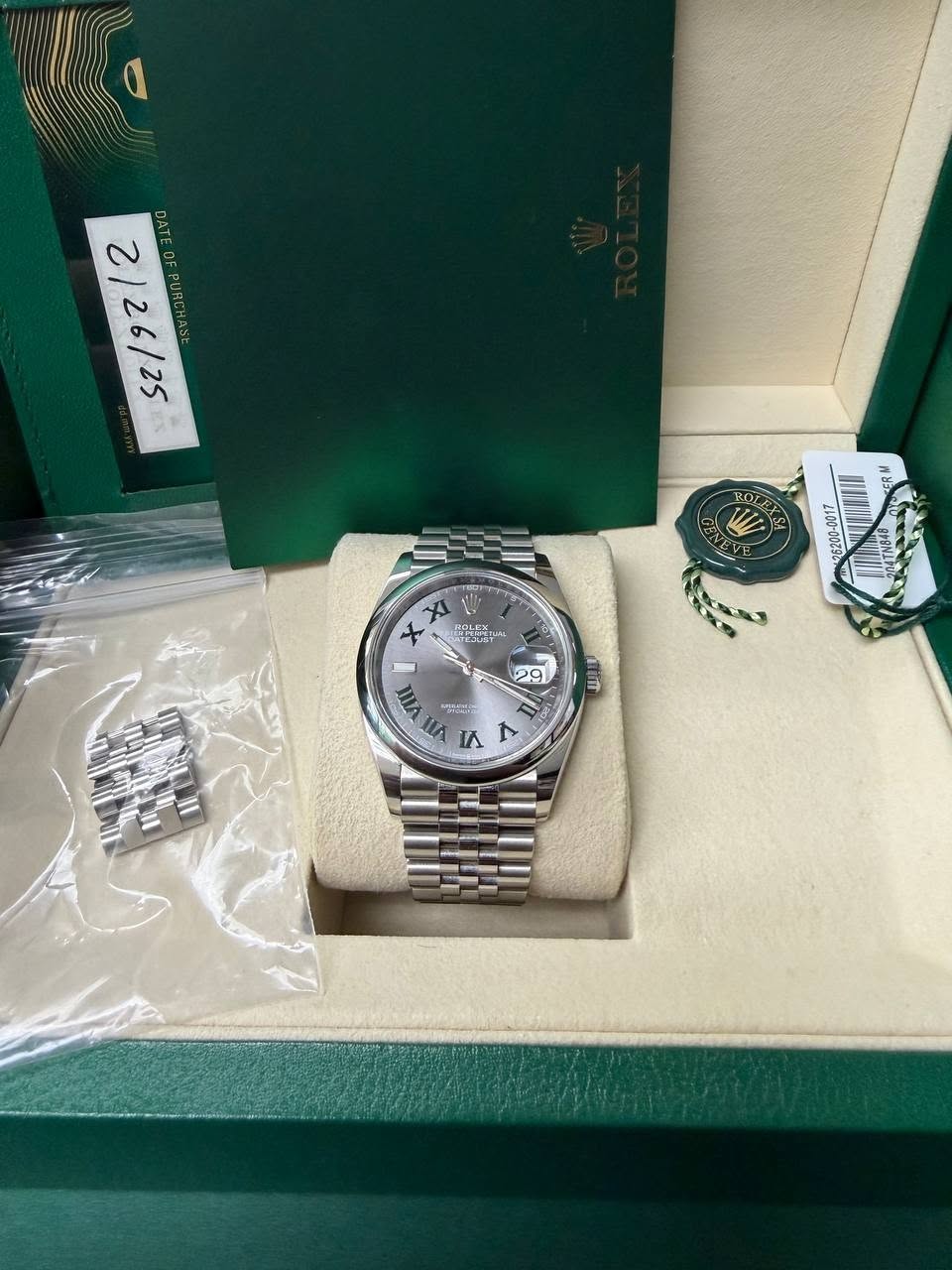 May be an image of wrist watch and text