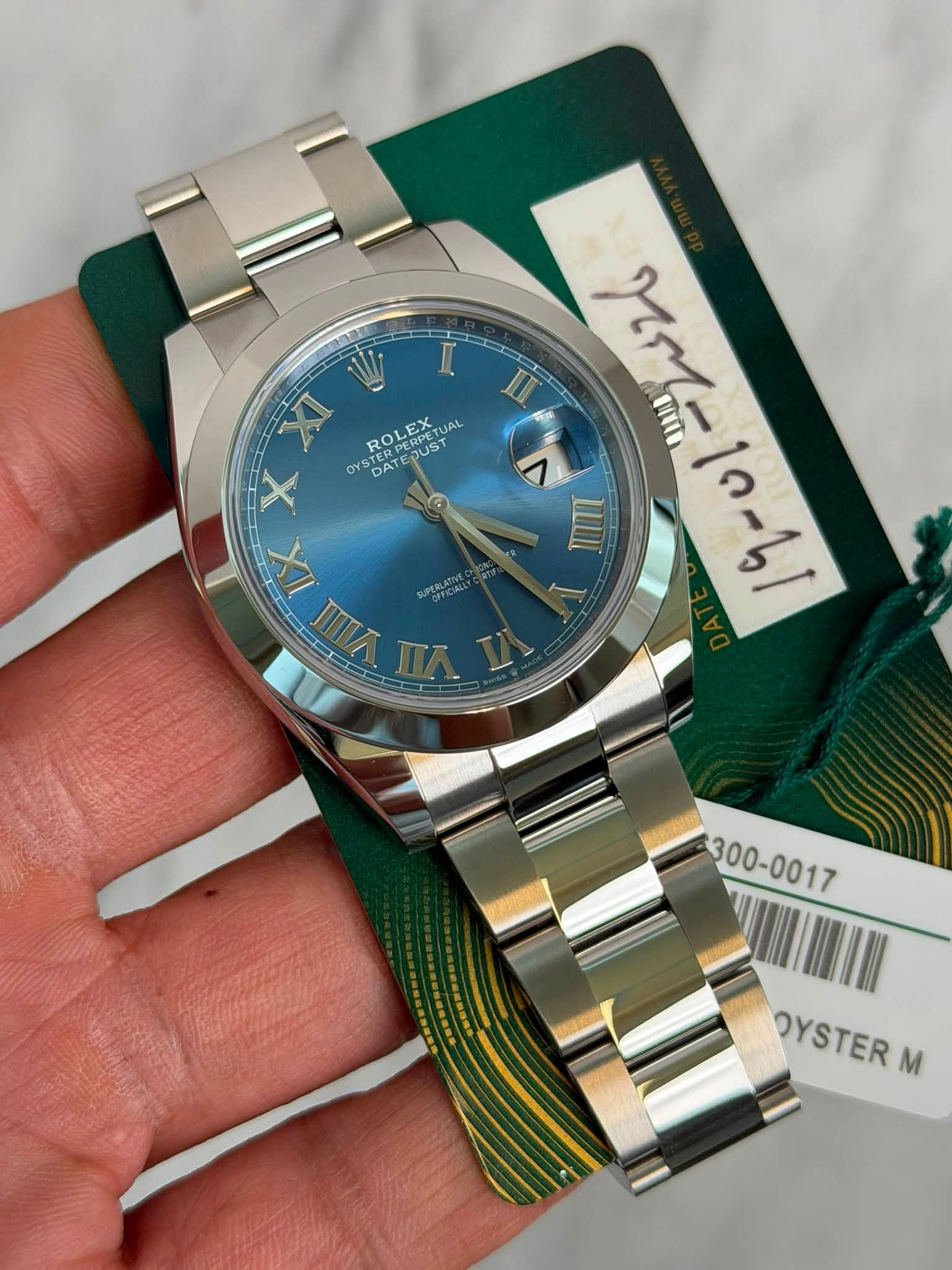 May be an image of wrist watch and text