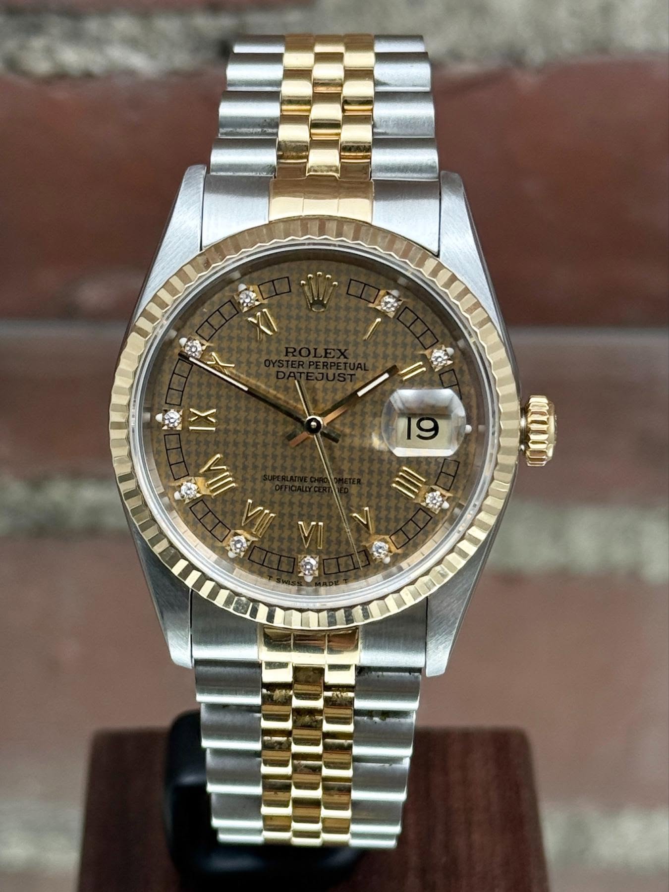 May be an image of wrist watch and text