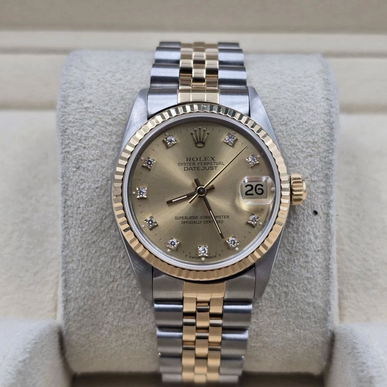 May be an image of wrist watch and text