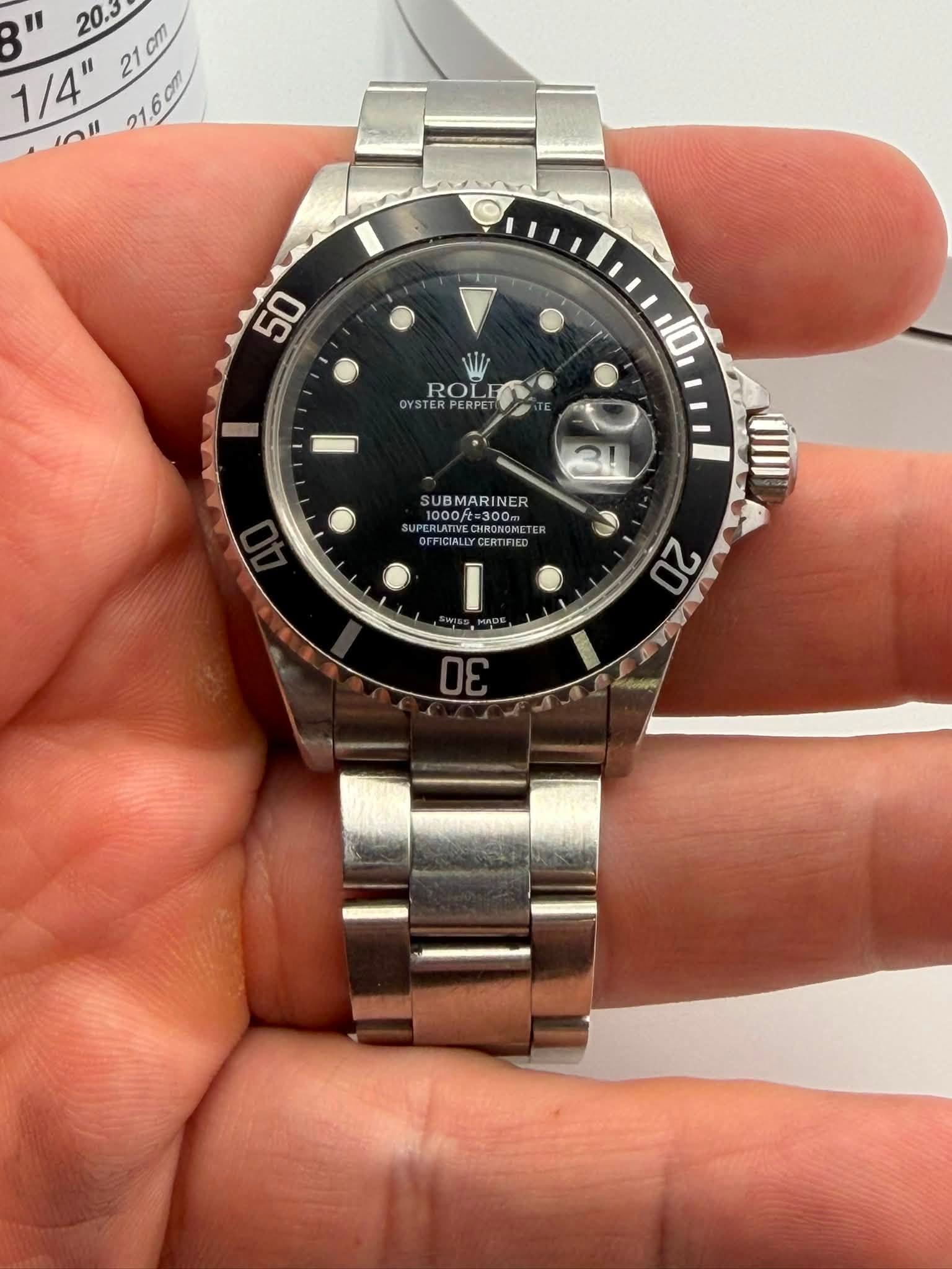May be an image of wrist watch and text that says 'B" " 1/4" 20.3 1/4"20 21 21cm 2100 T لدب in1 21.60m OYSTE YSTERPERPE ROLF ROL 10 SUBMARINER 000ft 1000/ 8300 UBMARINER…