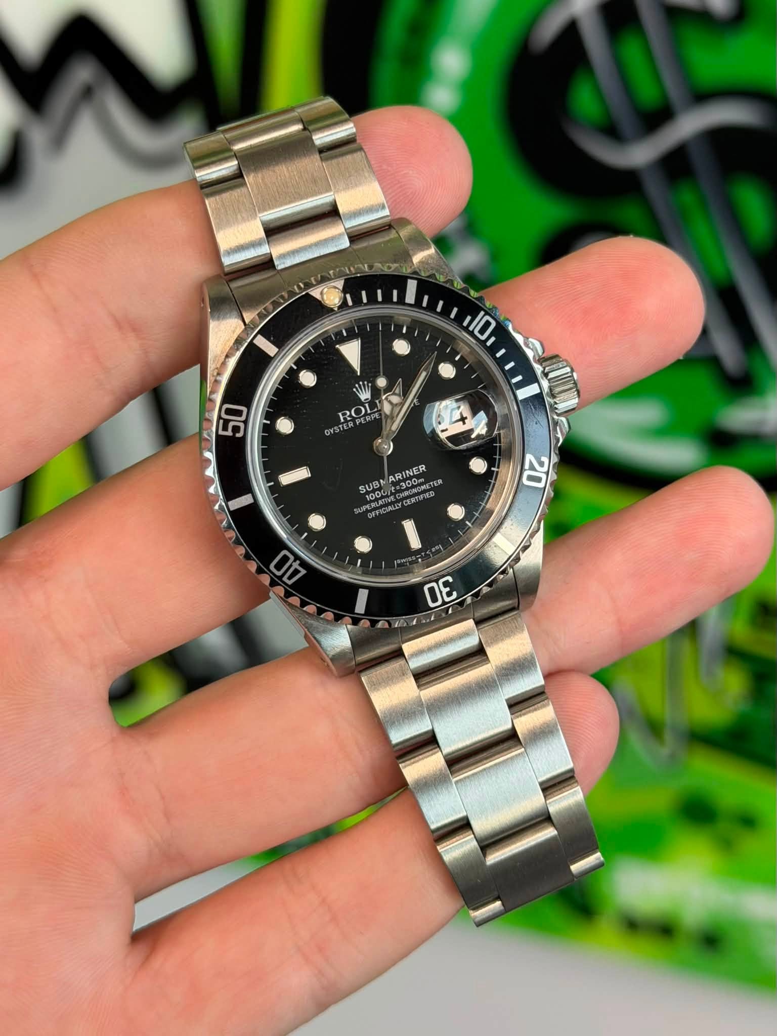 May be an image of wrist watch and text