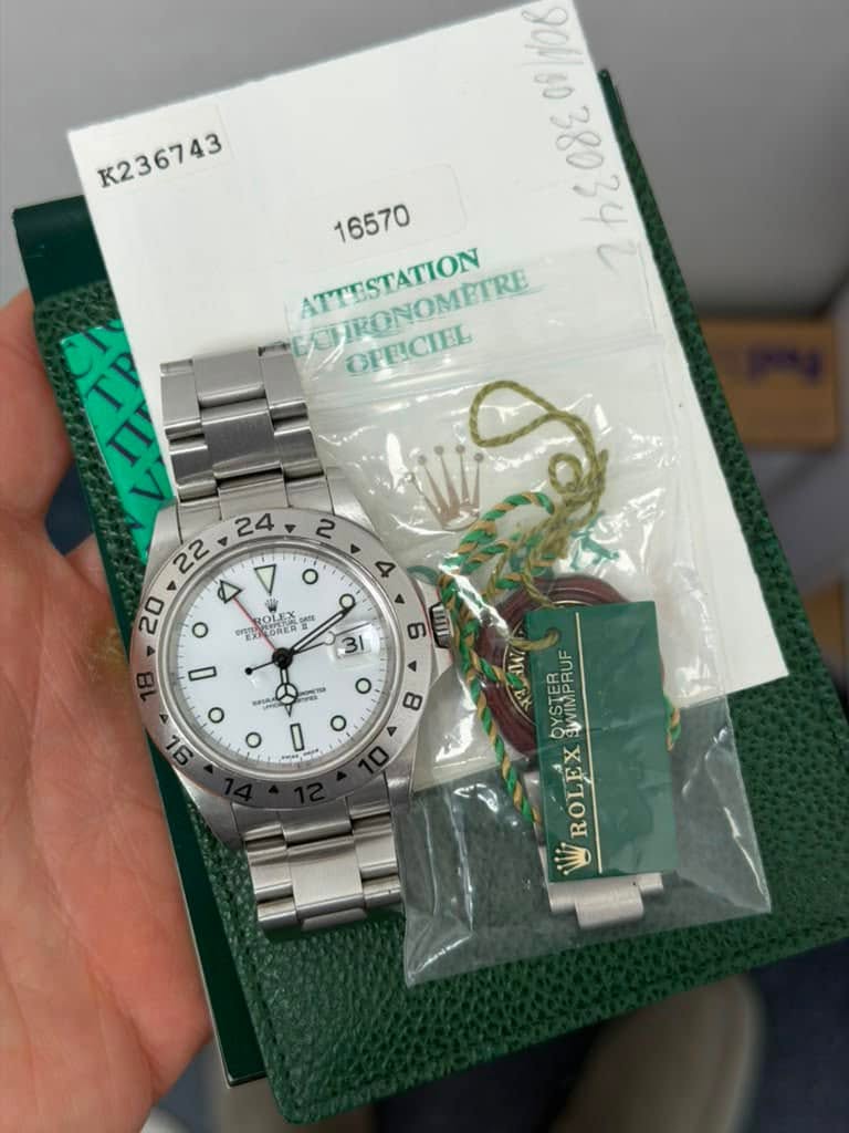 May be an image of wrist watch and text