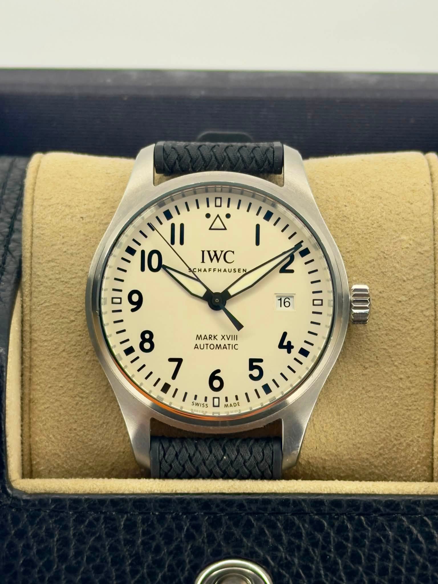 May be an image of wrist watch and text that says '2 16 II 10 IWC CHAFFHAUSEN 9 8 MARK XVIII AUTOMATIC SWISS MADE AD'