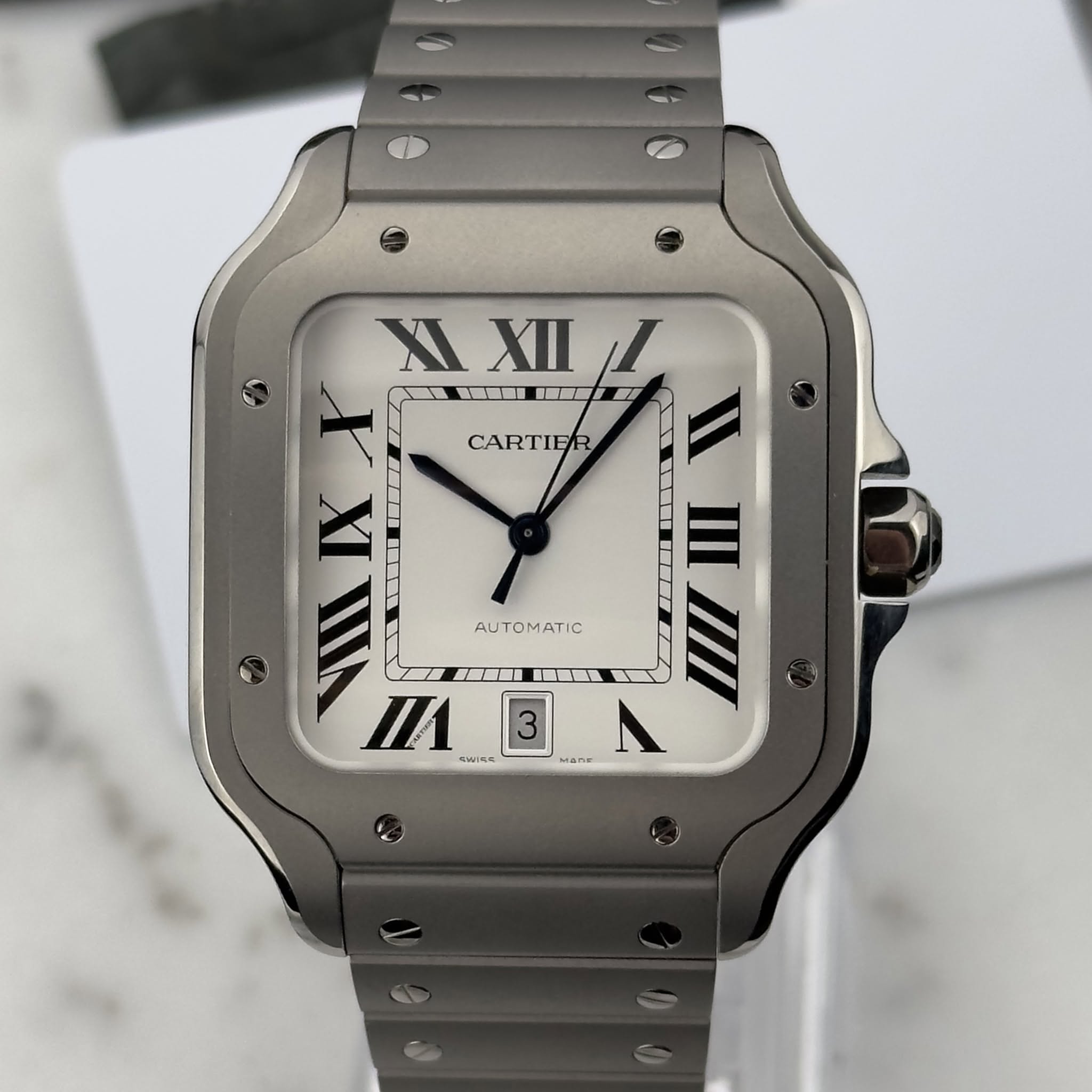 May be an image of wrist watch and text