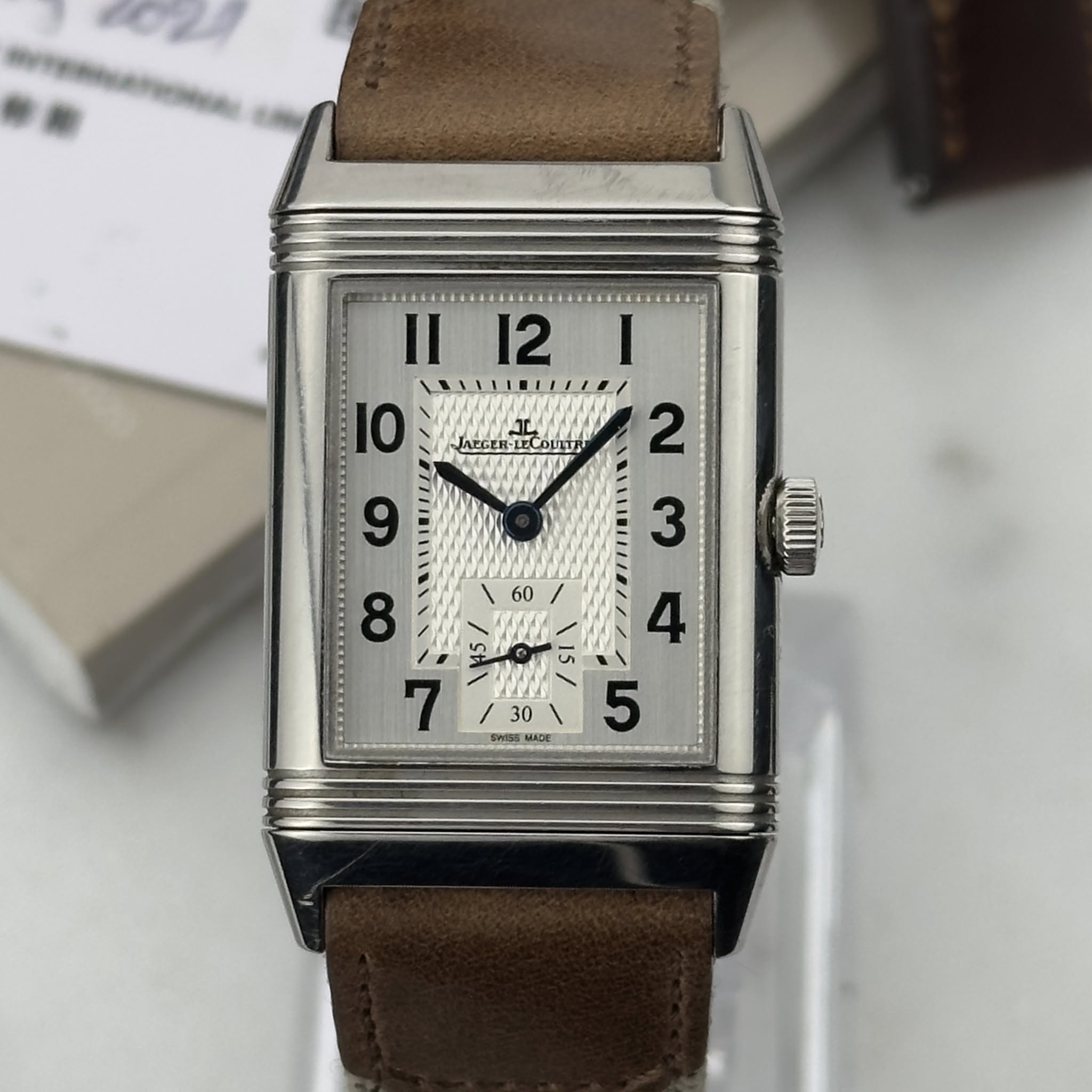 May be an image of wrist watch and text