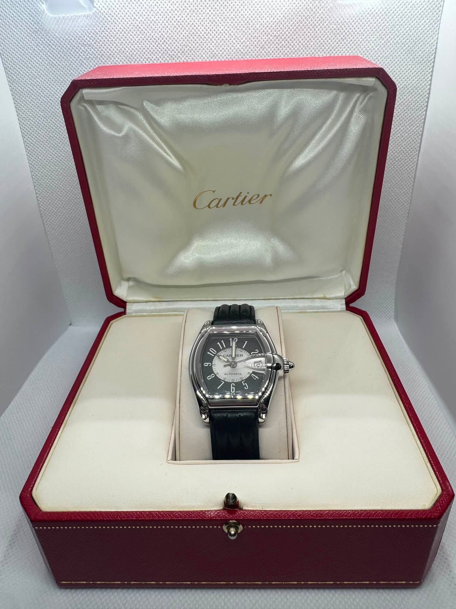 May be an image of wrist watch and text that says 'Cartier IN ER H'