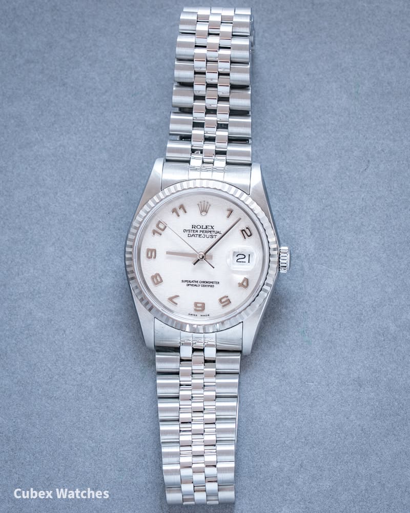 May be an image of wrist watch and text
