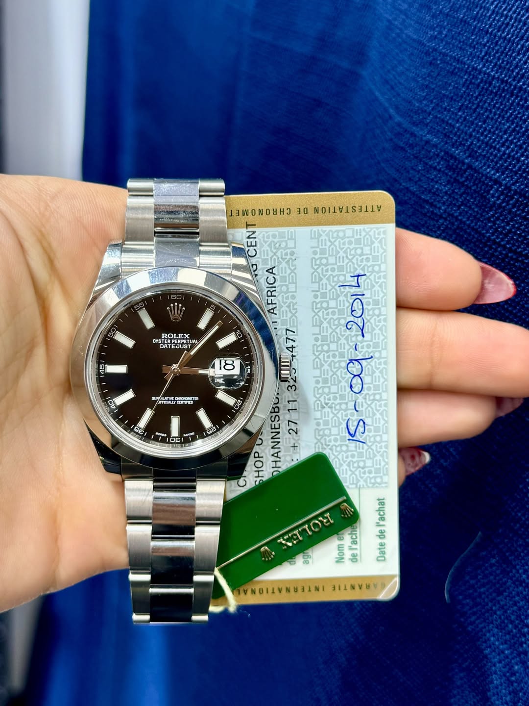 May be an image of wrist watch and text