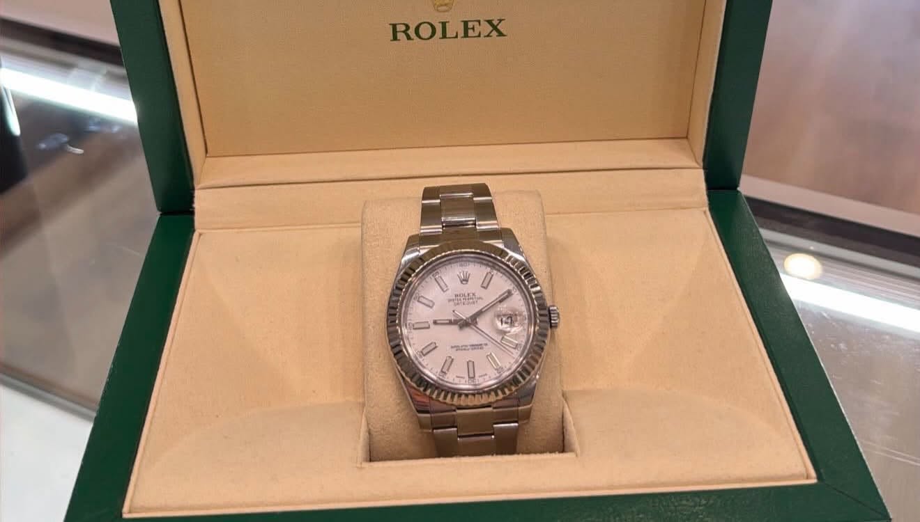 May be an image of wrist watch and text