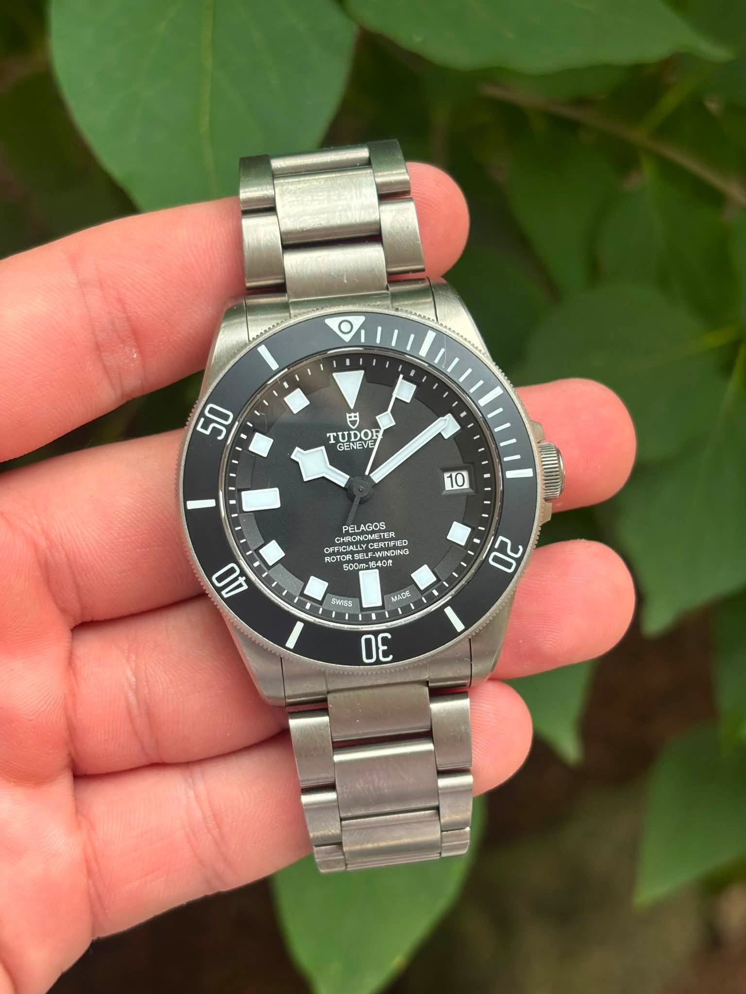 May be an image of wrist watch and text