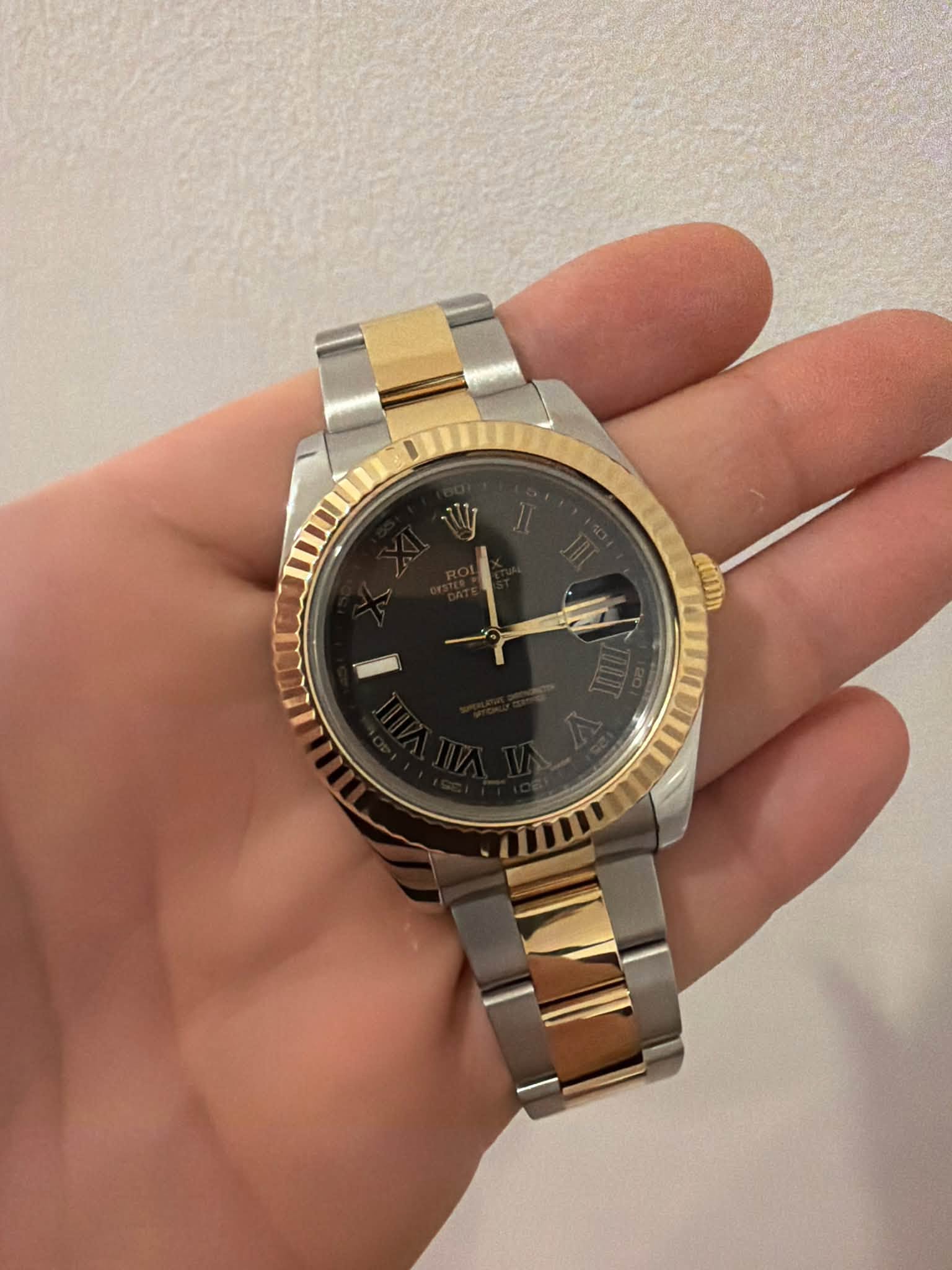 May be an image of wrist watch