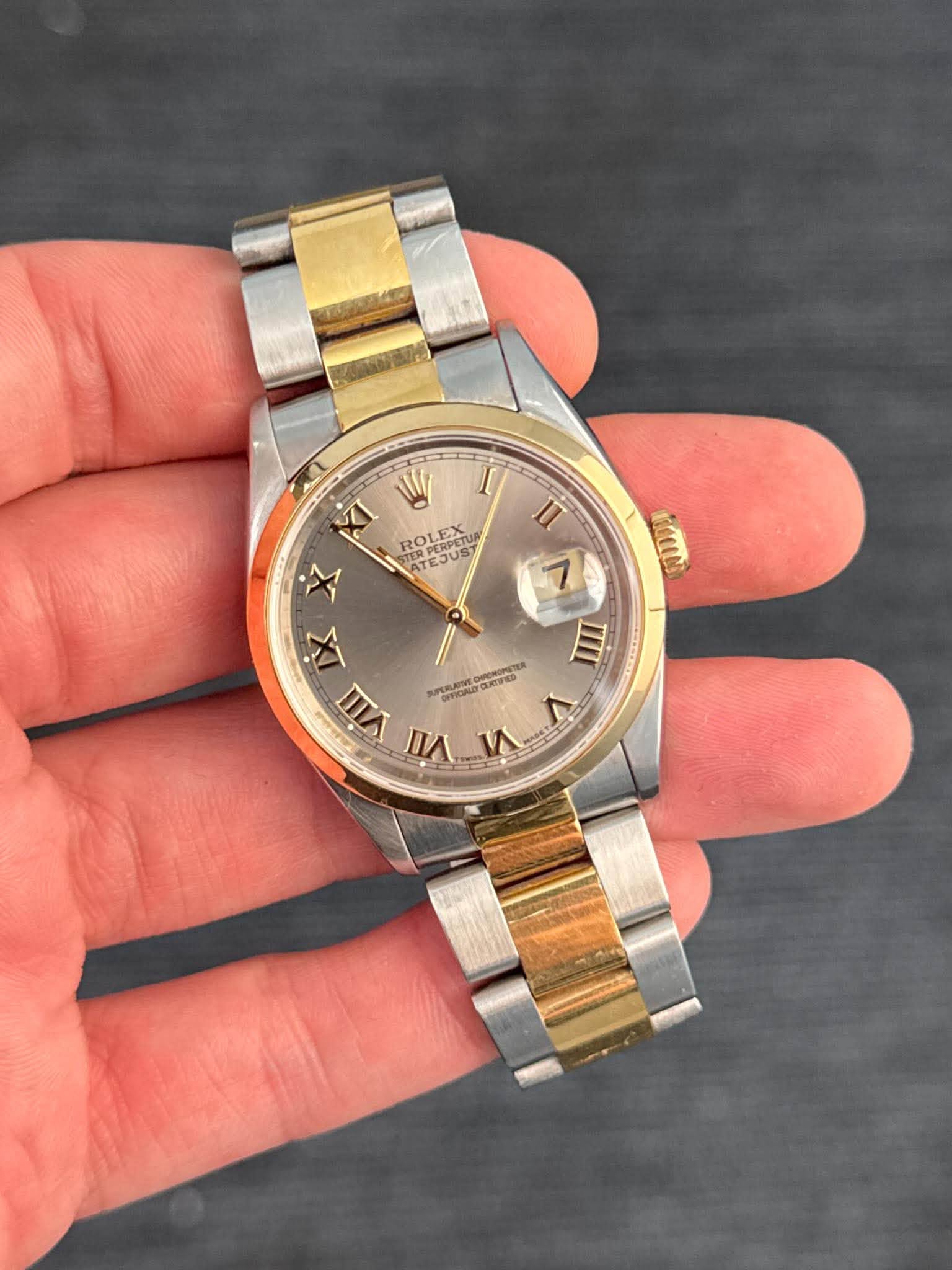 May be an image of wrist watch and text