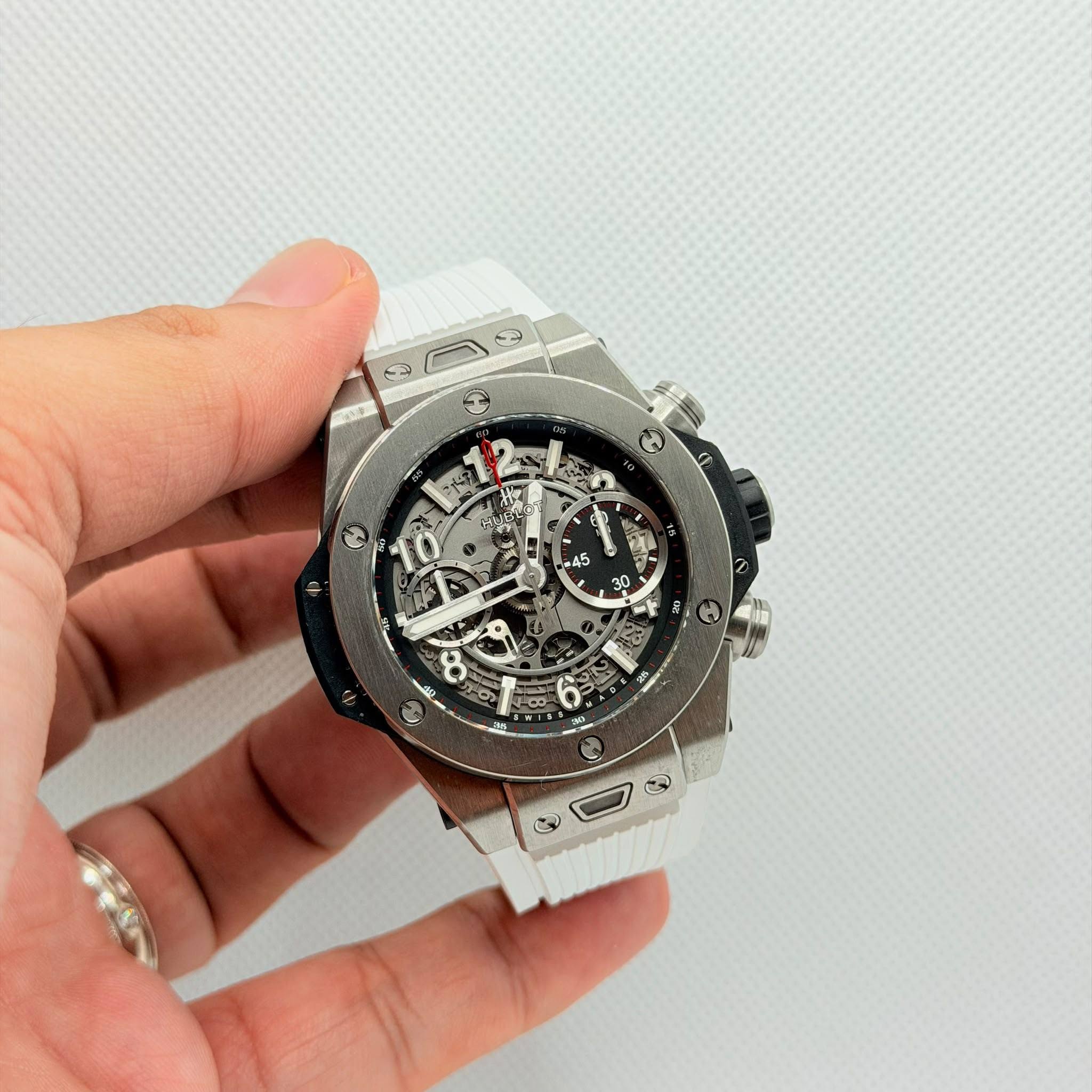 May be an image of wrist watch and text