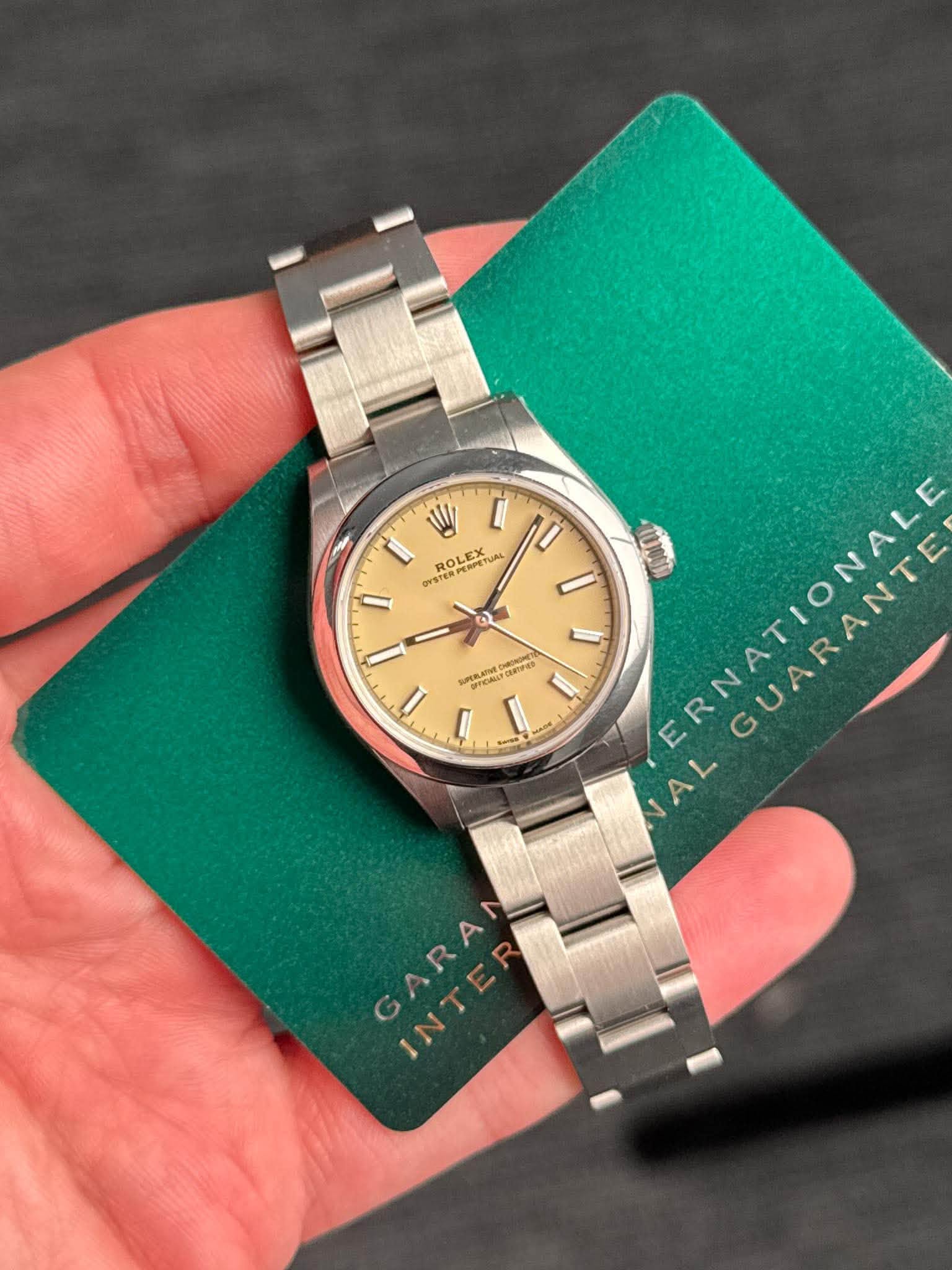 May be an image of wrist watch and text