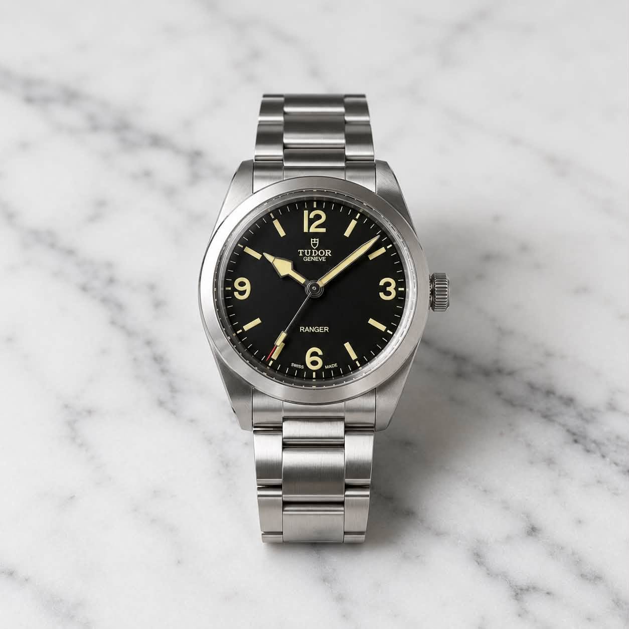 May be an image of wrist watch and text that says '12 TUI UDOR ENEVE UDOR DOR 9 I 3 - 1 RANGER 6'