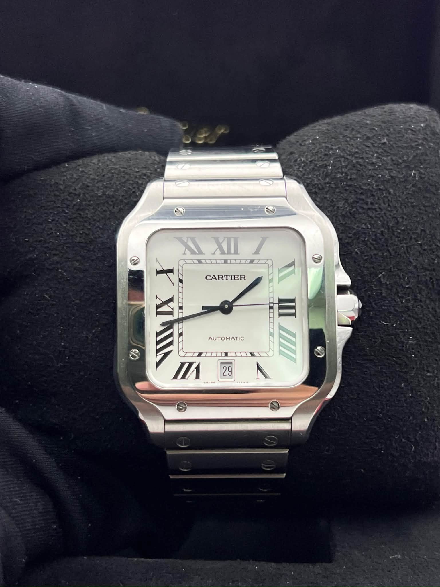 May be an image of wrist watch and text