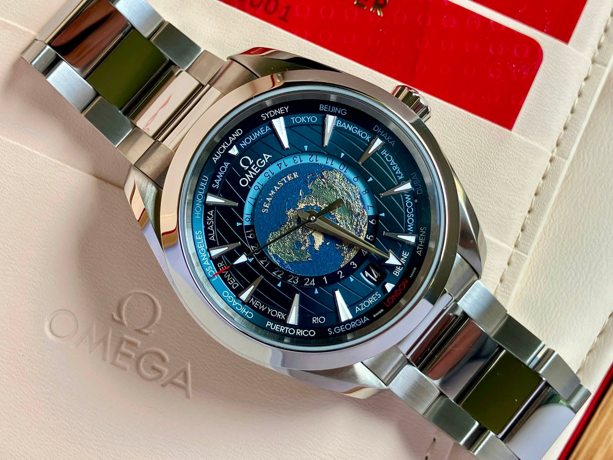 May be an image of wrist watch and text that says 'BANGKOK ケ אאיור كا MOMMOW SYDNEY TOKY AUCKLA AND NOUMEA HONOLULU SAMOA OMEGA 91 FAMASTER SL LAS ALASKA 8 OSANGELES OMEGA EC H…