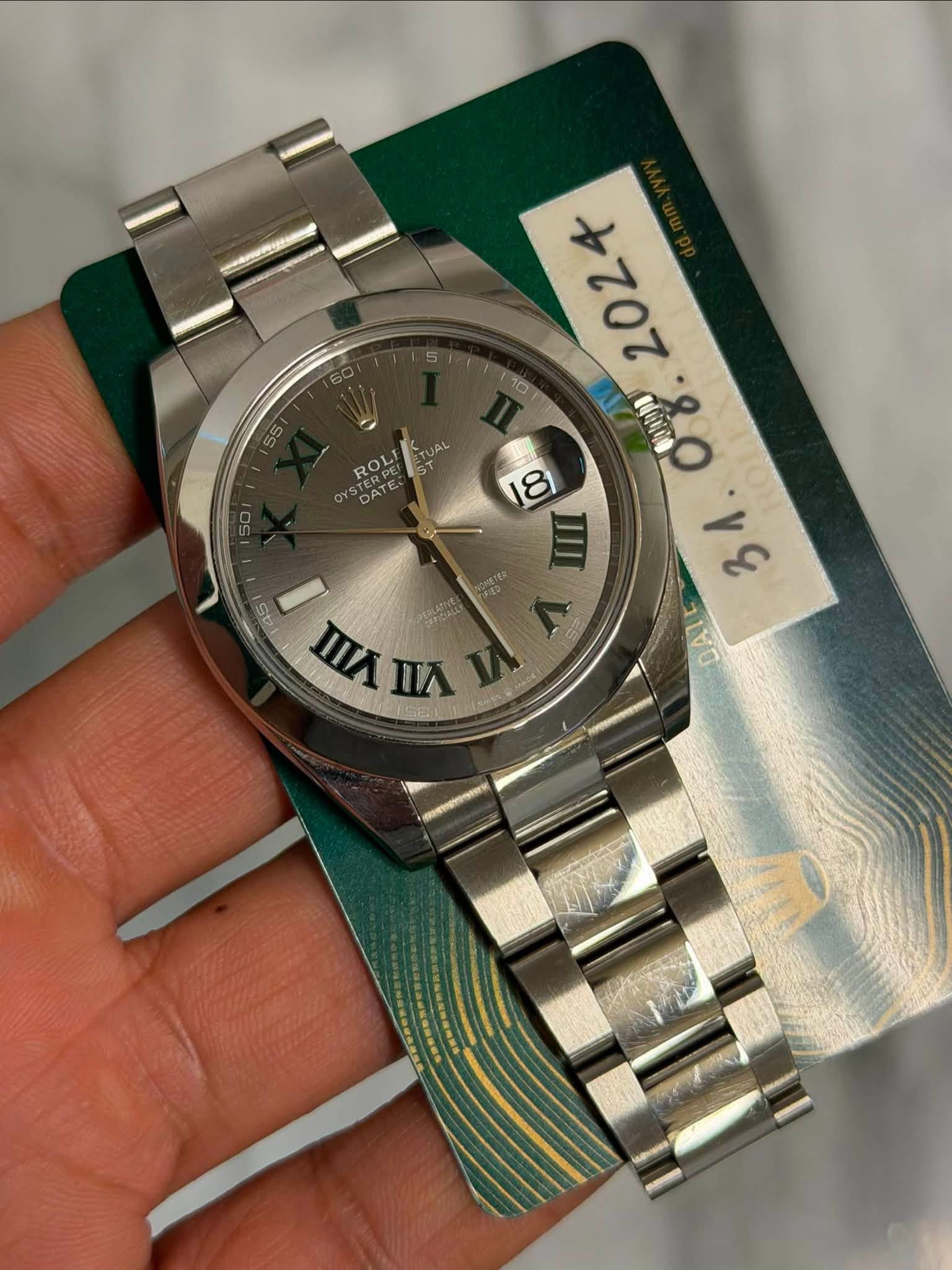 May be an image of wrist watch and text