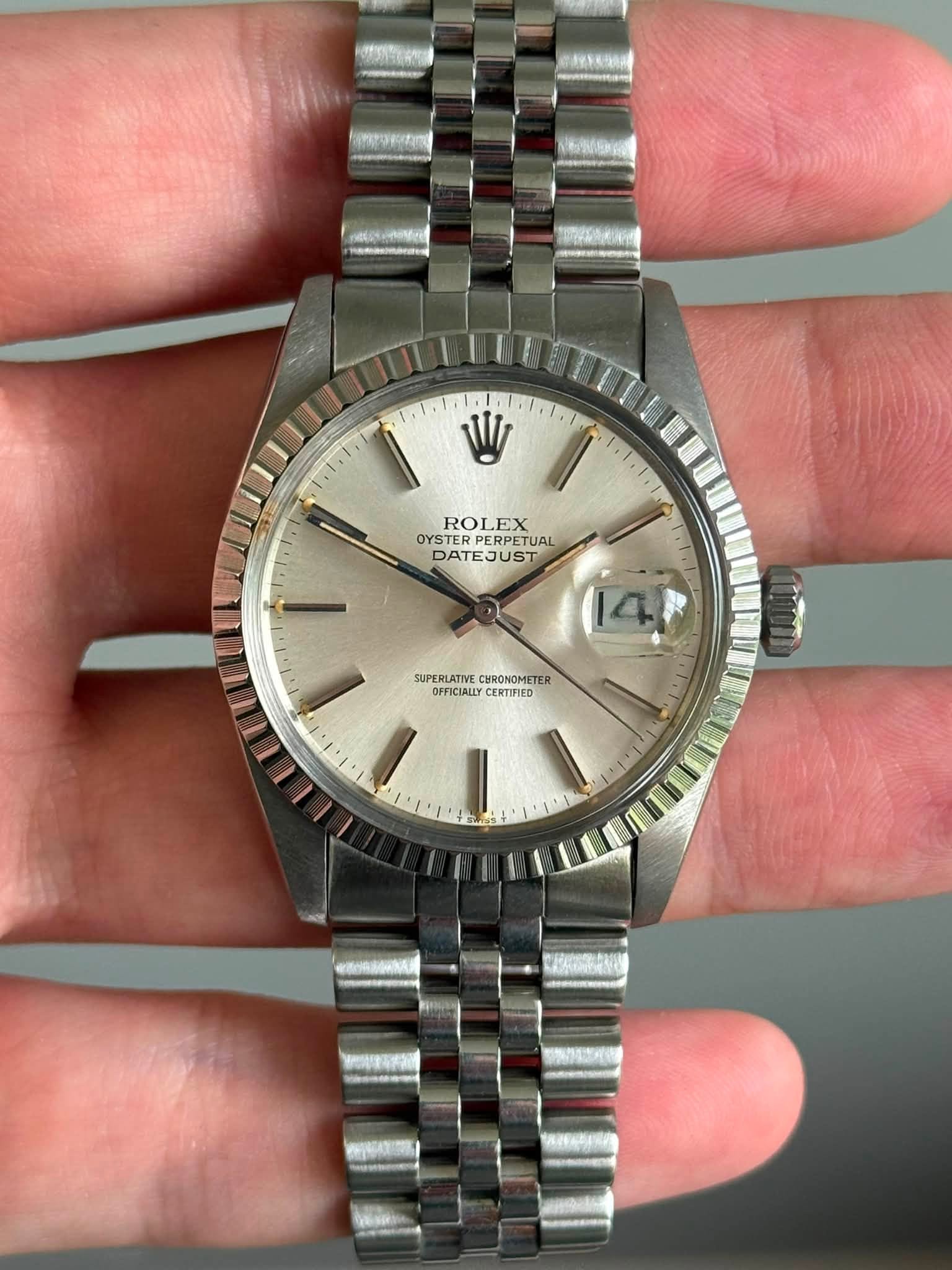 May be an image of wrist watch and text