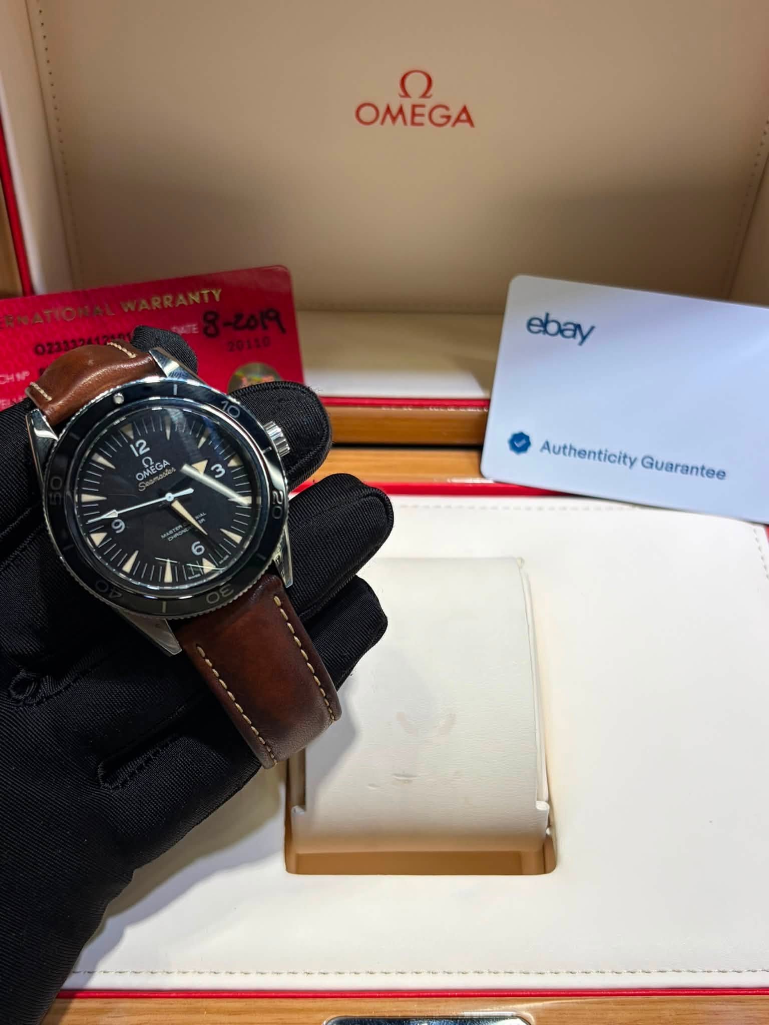 May be an image of wrist watch and text that says 'OMEGA د ع OMEGA ebay 12 OMEGA IKr m m 6 6 Authenticity AuthentiaityGuerantee Guarantee'