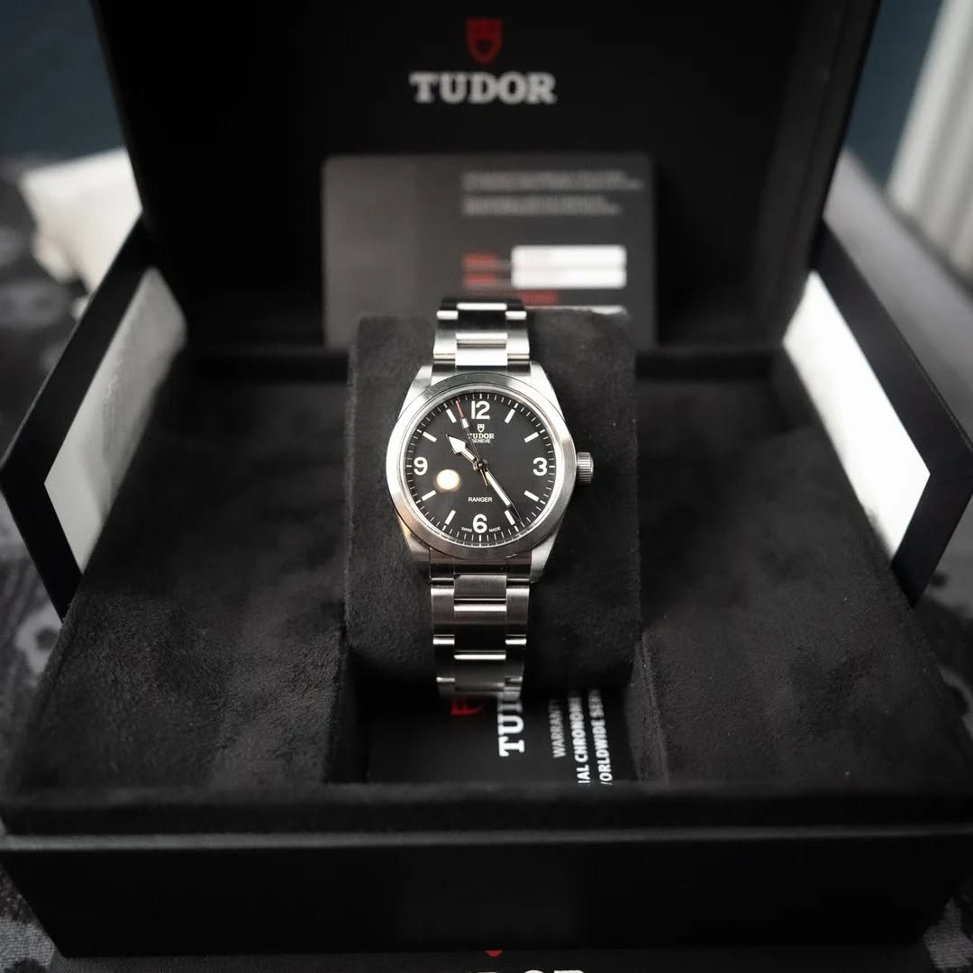 May be an image of wrist watch and text