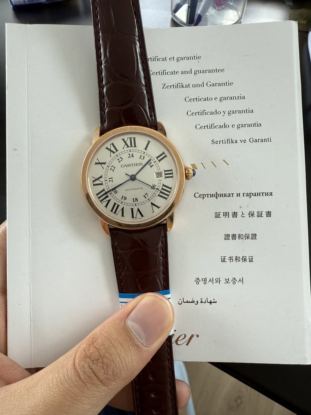 May be an image of wrist watch and text that says 'tificat et garantie Cerlificate and guaranlee Zertifikat und Garantie Certicato garanzia Certificadoy garantia Certificado e…