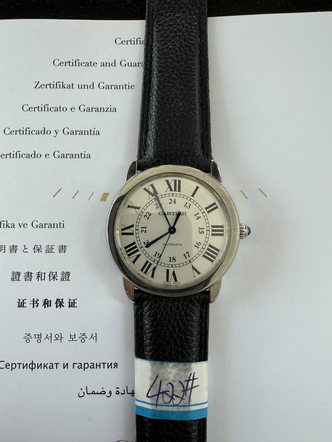 May be an image of leather, wrist watch and text that says 'Certifid Certificate and Guara Zertifikat und Garantie Certificato e Garanzia Certificado Garantía ertificado e…