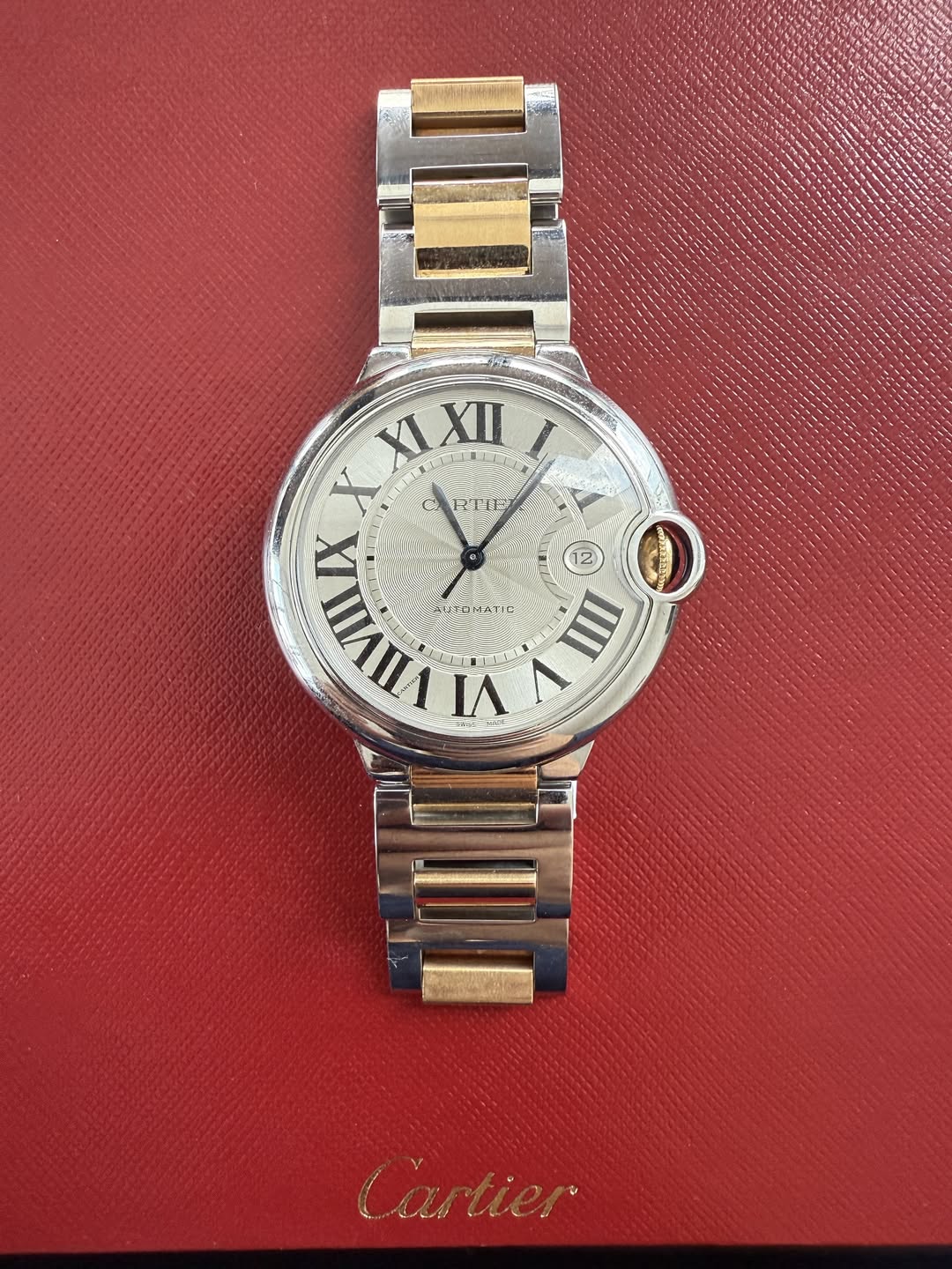 May be an image of wrist watch and text