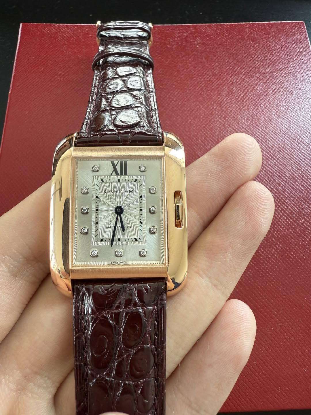 May be an image of wrist watch and text