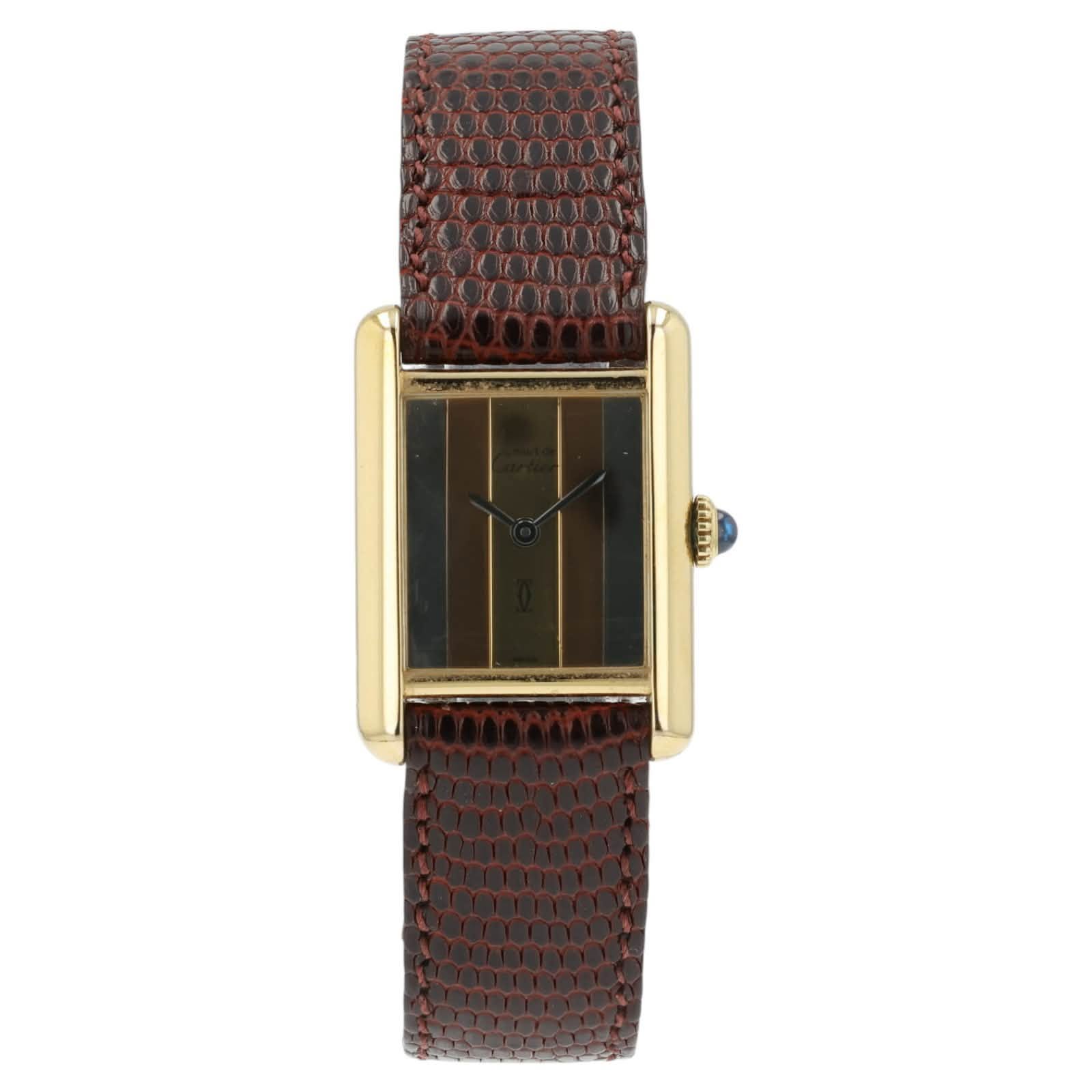 May be an image of leather, wrist watch and text