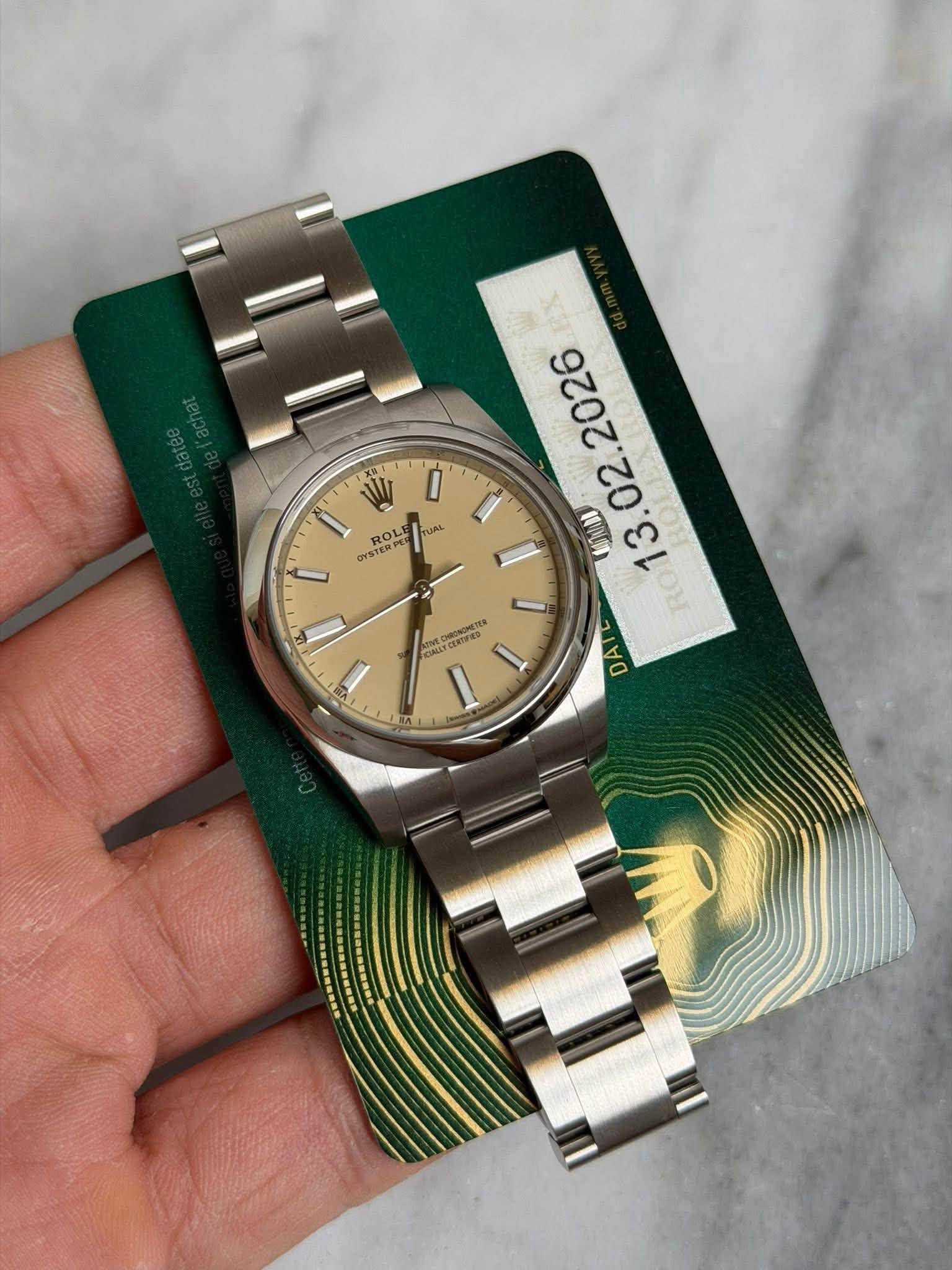 May be an image of wrist watch and text that says '集 ROLE TUAL OYSTA YSTERPE ROL RO 2026 02. MUNAI g Erens EOIRED CALY DAI'