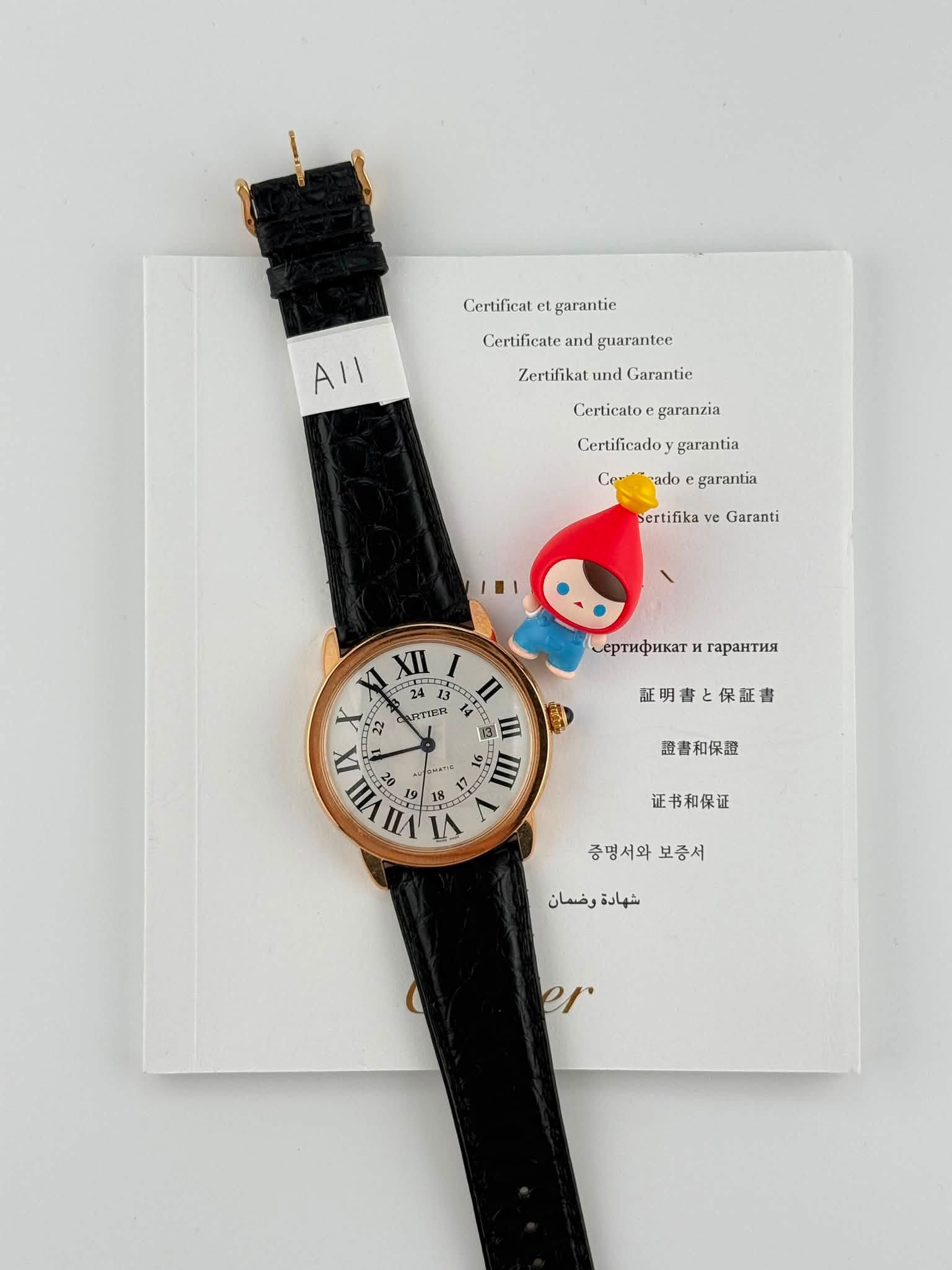 May be an image of wrist watch, leather and text that says 'Certificat et garantie Certificate and guarantee ΑΙ Zertifikat and Garantie Certicatoe garanzia Certificadoy garantia…