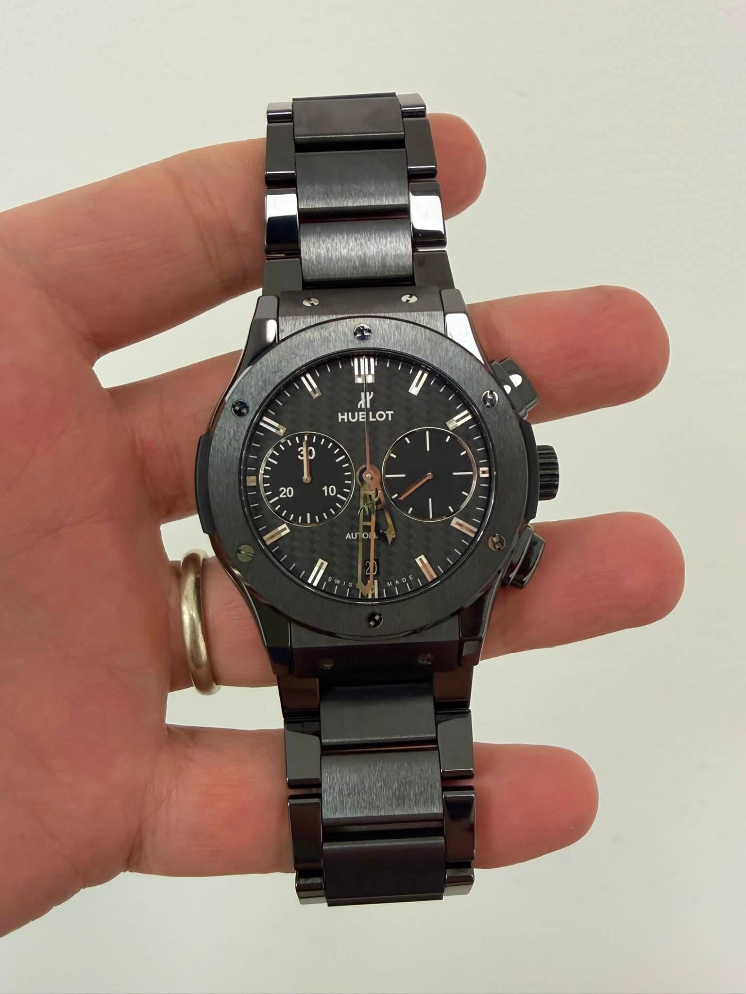 May be an image of wrist watch and text