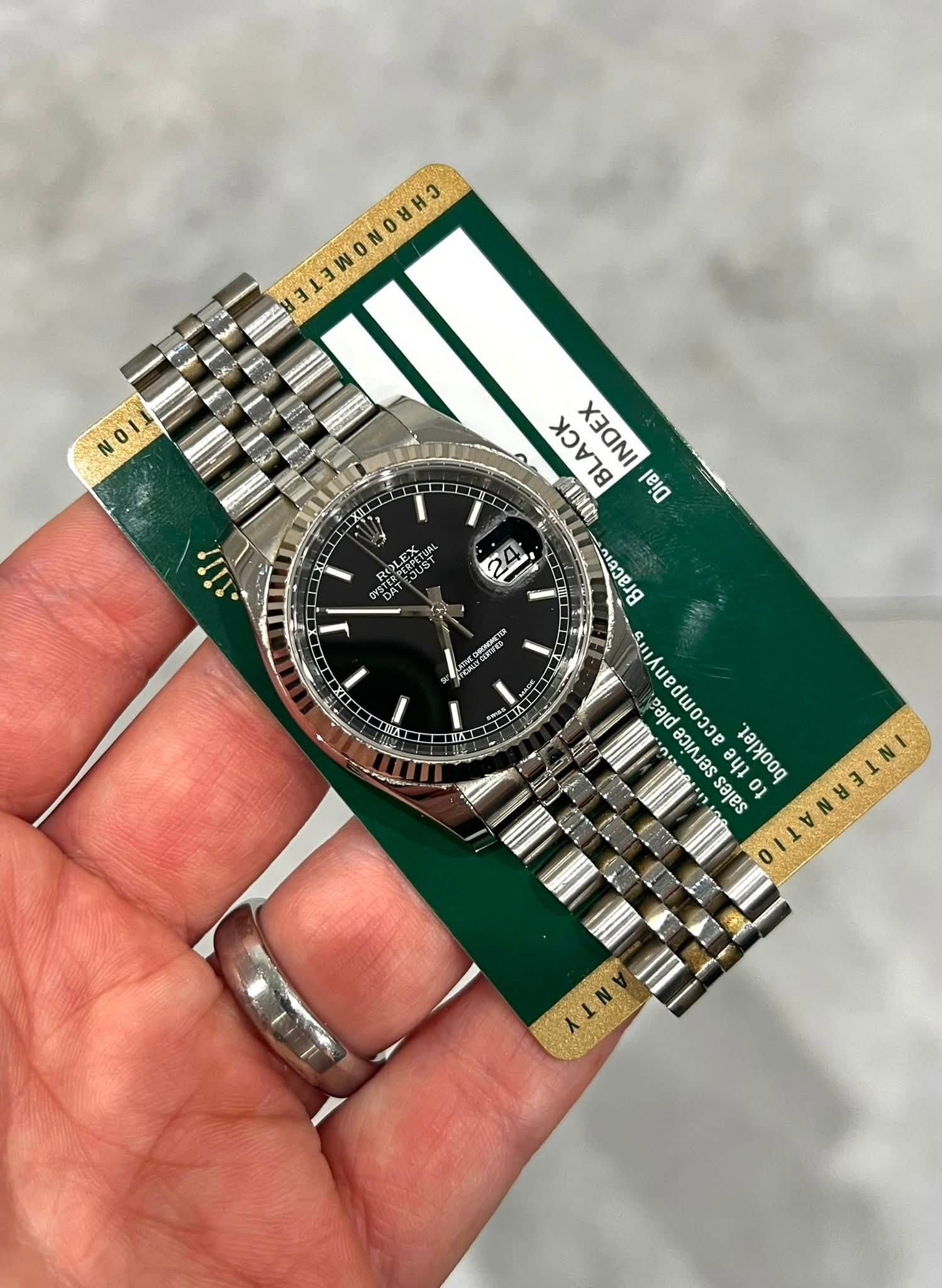 May be an image of wrist watch and text