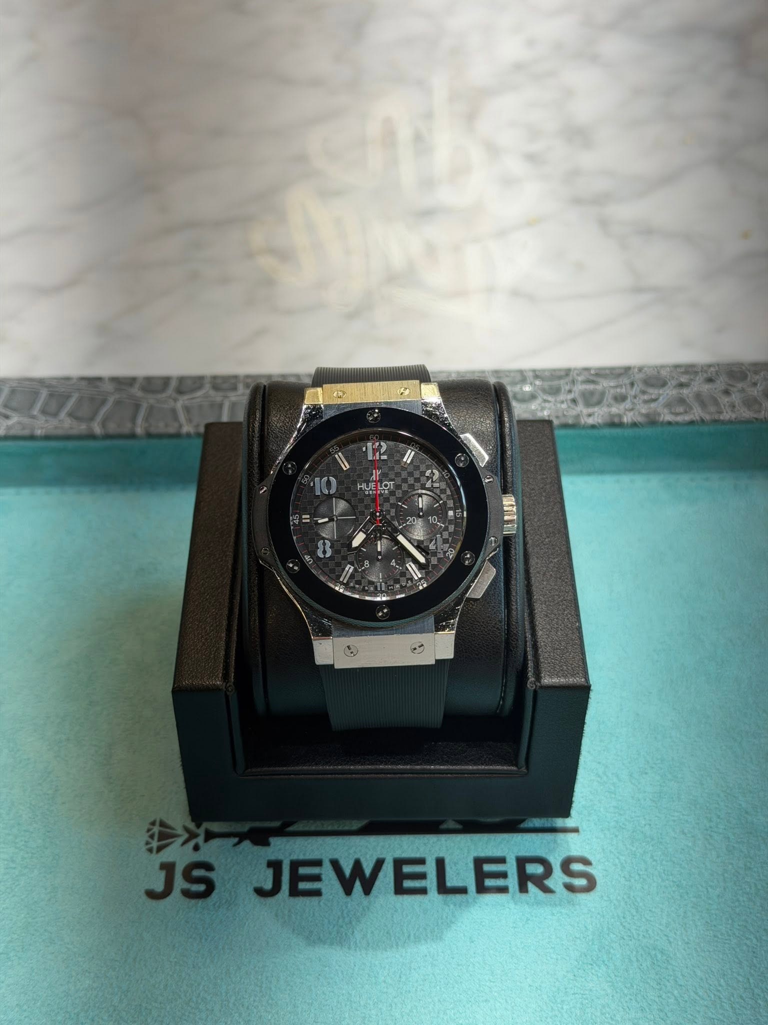 May be an image of wrist watch and text