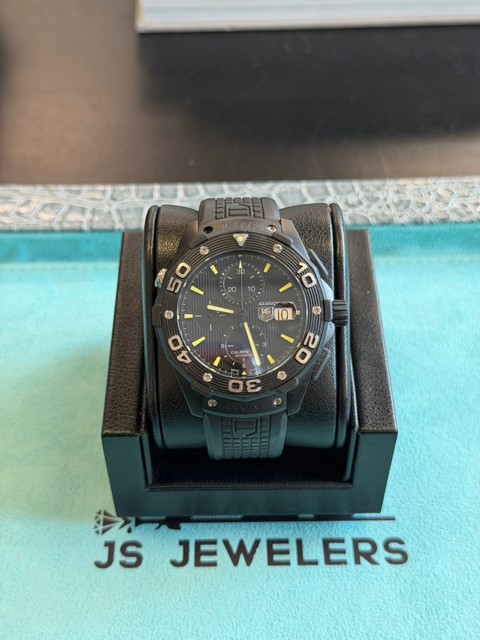 May be an image of wrist watch and text that says '尚聞 D D D 20 10 D ٠ G 10 एटना 屋 9一 DLOTA 4 0 20 JS JEWELERS'