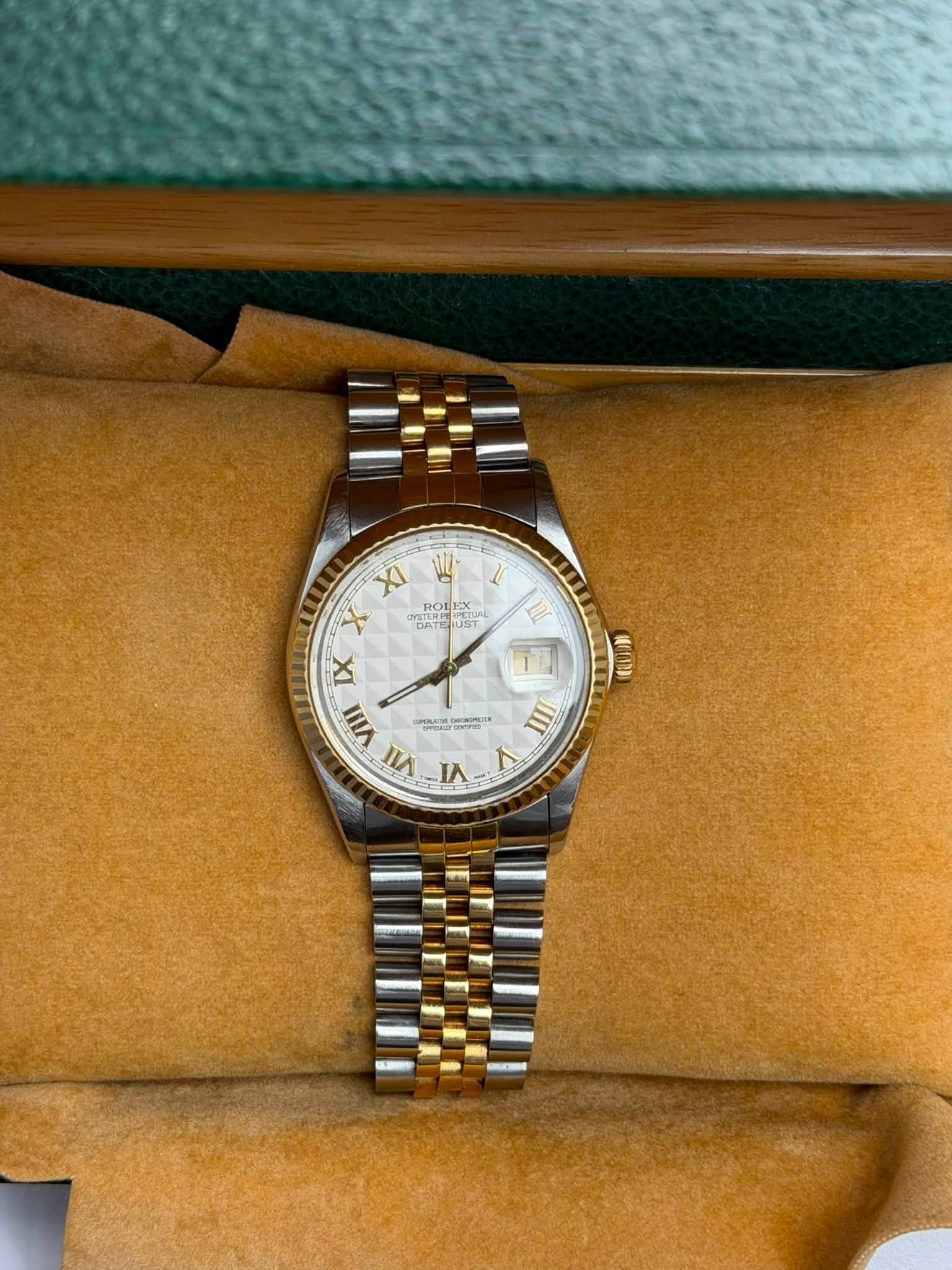 May be an image of wrist watch and text
