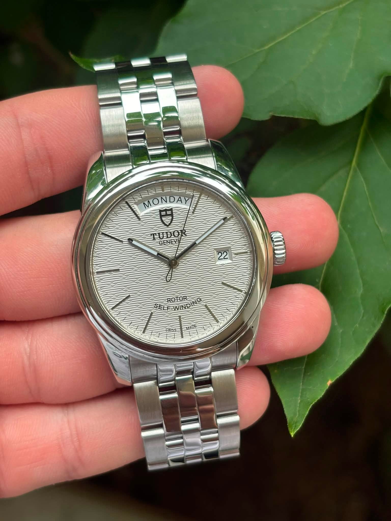 May be an image of wrist watch and text