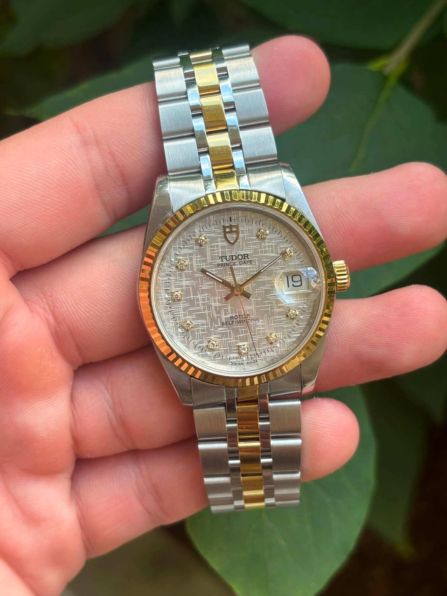 May be an image of wrist watch and text