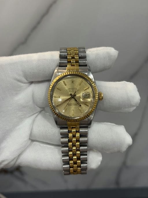 May be an image of wrist watch and text