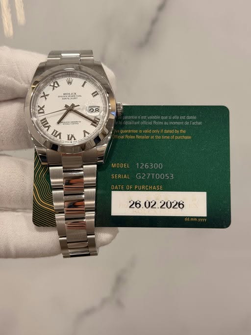May be an image of wrist watch and text that says 'XI X DMTE OE ROLEX 1.X ITEN MTEJUNT 4 VIII VII PA5 00 1 Kp ク I DE τα L 26300 G27T0053 DATEOFPURCHASE '