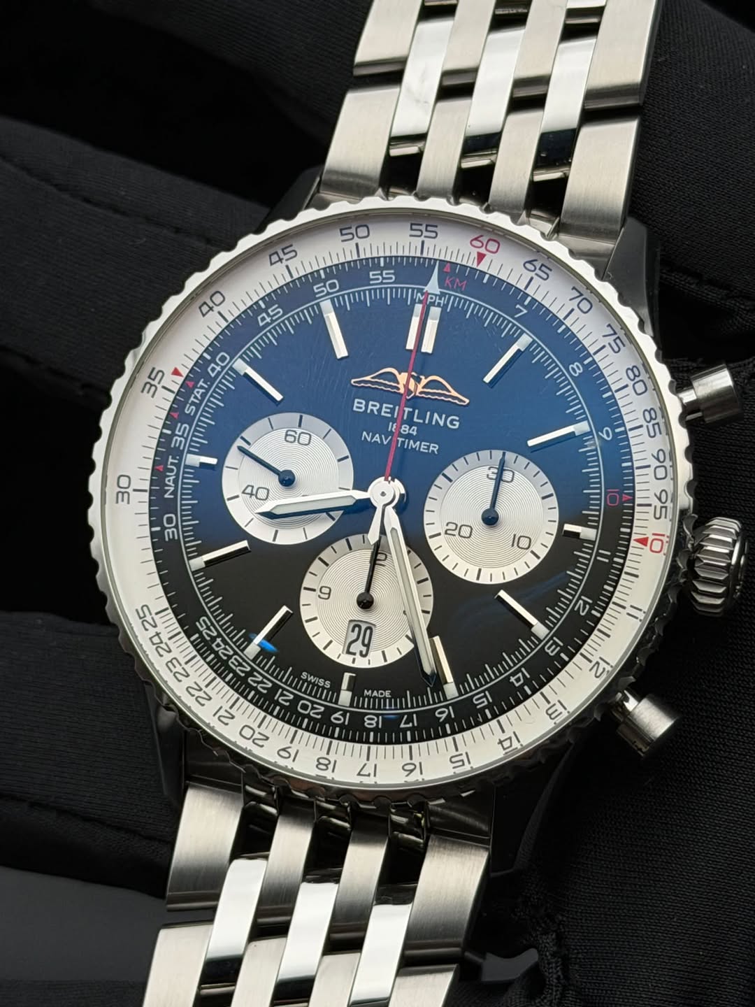 May be an image of wrist watch and text that says '50 55 45 ا///۱۱۱۱۱١ 60 50 αpηpp に 35 40 STAT 35 NAUT. 30 60 BREITLING 184 BREI NAV NAVTIMER 84 TLING TIMER AUSUUU SWISS 0Z 6I…