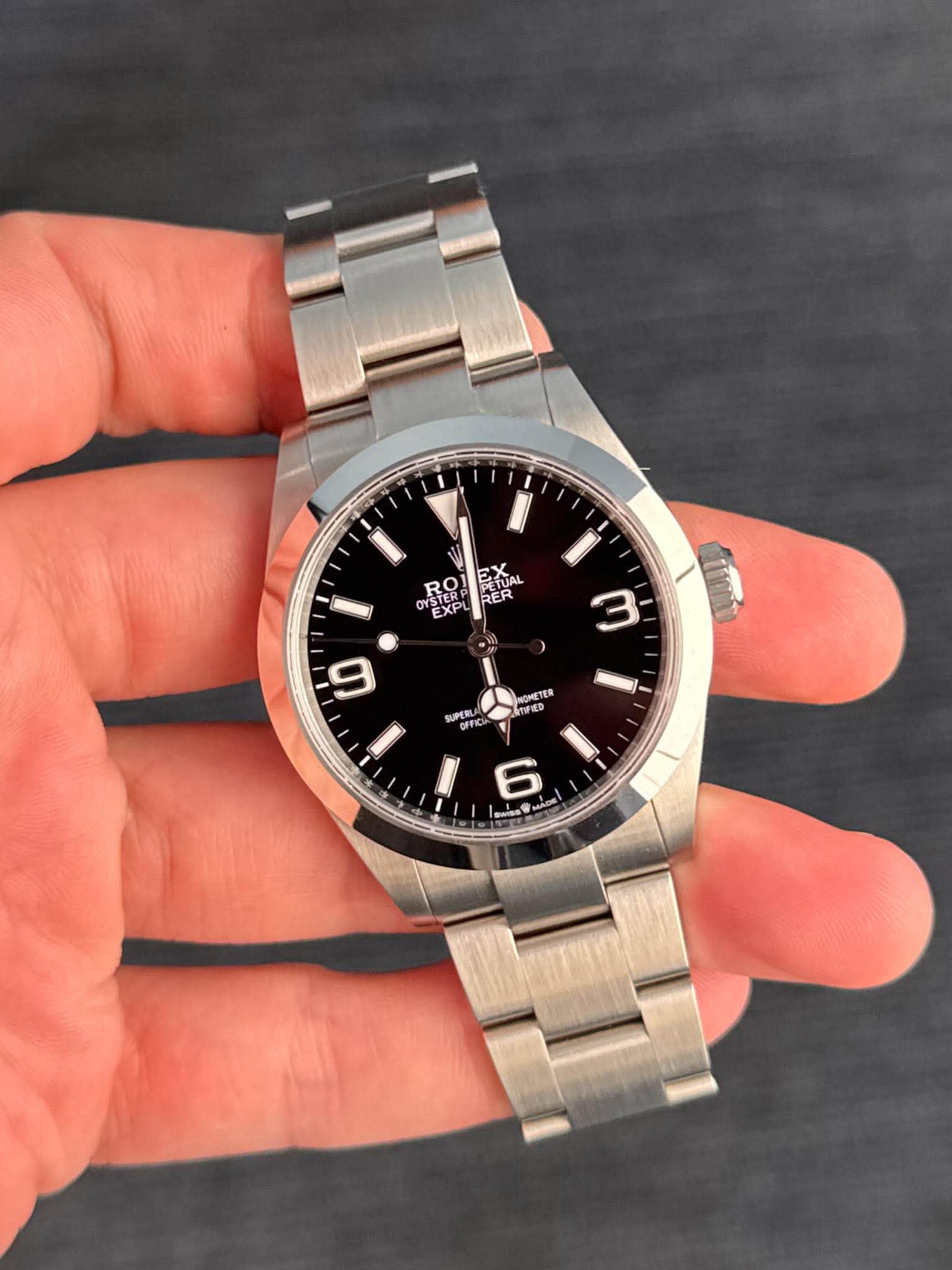 May be an image of wrist watch and text